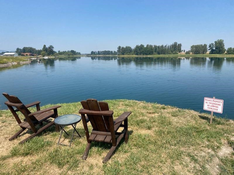 * BACK ON THE MARKET & SELLER OFFERING $60K CREDIT FOR INTEREST RATE BUY DOWN, CLOSING COSTS, OR BUILD A BARN/SHOP! 2 Newer Beautiful Homes on 10.42 acres in Lower Valley w/pond frontage PLUS an easement on Flathead River w/private floating DEEP WATER 4 boat dock! Premium finishes:Custom cabinets, quartz countertops,LVP floors,heated tile in bath. Single level home w/storage galore. Luxurious primary suite w/ fireplace, a private deck and a to-die-for ensuite. Enjoy the jetted tub overlooking the pond, or choose the beautifully tiled shower. The screened in porch with heaters and it's own fireplace adds an additional 500 sf of entertaining space. Guest House has 2 separate suites with ensuite baths, plus kitchen, living room & carport. Use for family or rent it out. Fully fenced with an indoor kennel - Horse & Pup friendly! Possible seller financing. Call Mandi Luce-Heinle at (406) 351-9943, or your real estate professional. The lower portion of the property in 100 year flood plain. Too many features to mention!  Please ask for the full feature sheet and all associated documents.