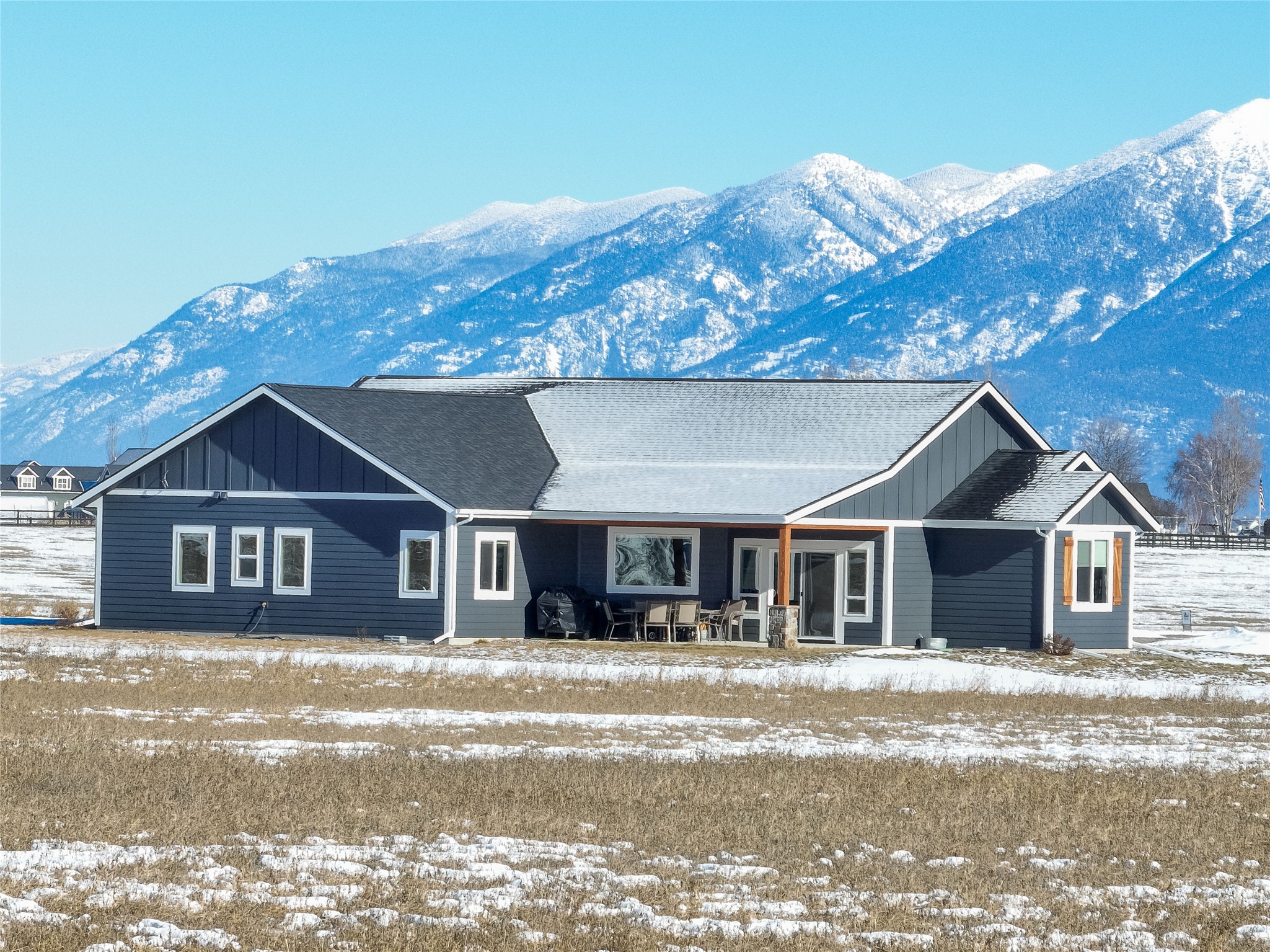 MONTANA COUNTRY LIVING AT IT'S FINEST!  This single-level, charming home is peacefully tucked away on 5 acres of horse property in the Lower Valley countryside.  360 degree unobstructed mountain views surround this beautiful homestead while only being minutes from Bigfork, Lakeside, and Kalispell.  The interior of the home boasts custom alder cabinetry, circle-sawn fir flooring, vaulted ceilings, granite countertops, walk-in tiled shower, oversized soaking tub, custom rock fireplace, coffee bar, and so much more!  Enjoy the evening sunsets expanding over the Big Sky under the covered patio as the wildlife graze the property.  THIS IS A MUST-SEE!  Call April Moser at 406-885-2313 or your Real Estate Professional for more details.