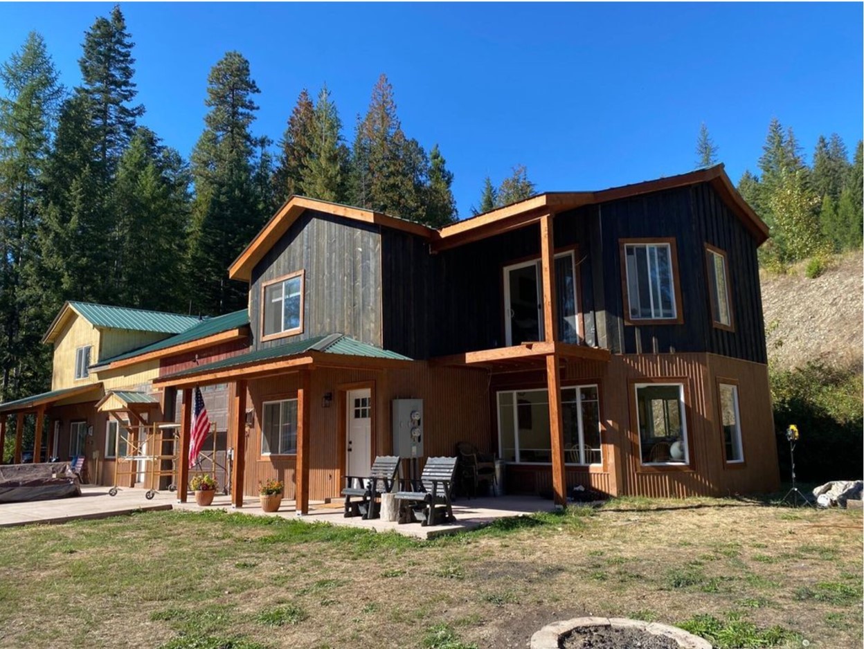 A Quintessential Northwest Montana townhome/duplex property.    Includes 2 unique townhouses with side A) 2676 sq ft, with 3 bedrooms 2.5 bath units, side B) 3268 sq ft with 4 bedrooms 2.5 bath units.  The 2 parcels total 1.6 acres overlooking the Cabinet Gorge on the Clark Fork River Avista Utilities frontage and south to the Bitterroot Mountain range.  This property has an excellent VRBO income / investment history with easy access from Highway 200.  The new buyer could maintain the income / investment portion of the townhouses and live in the other or rent out both.  Would also make a great multi-family investment using both sides for family or friends.  There is a bench between the townhouses and the highway, with a storage shed, and room for a shop, storage outbuildings, or additional parking.    You can also catch Amtrak either in Sandpoint, ID or Libby, MT for travel either east or west.