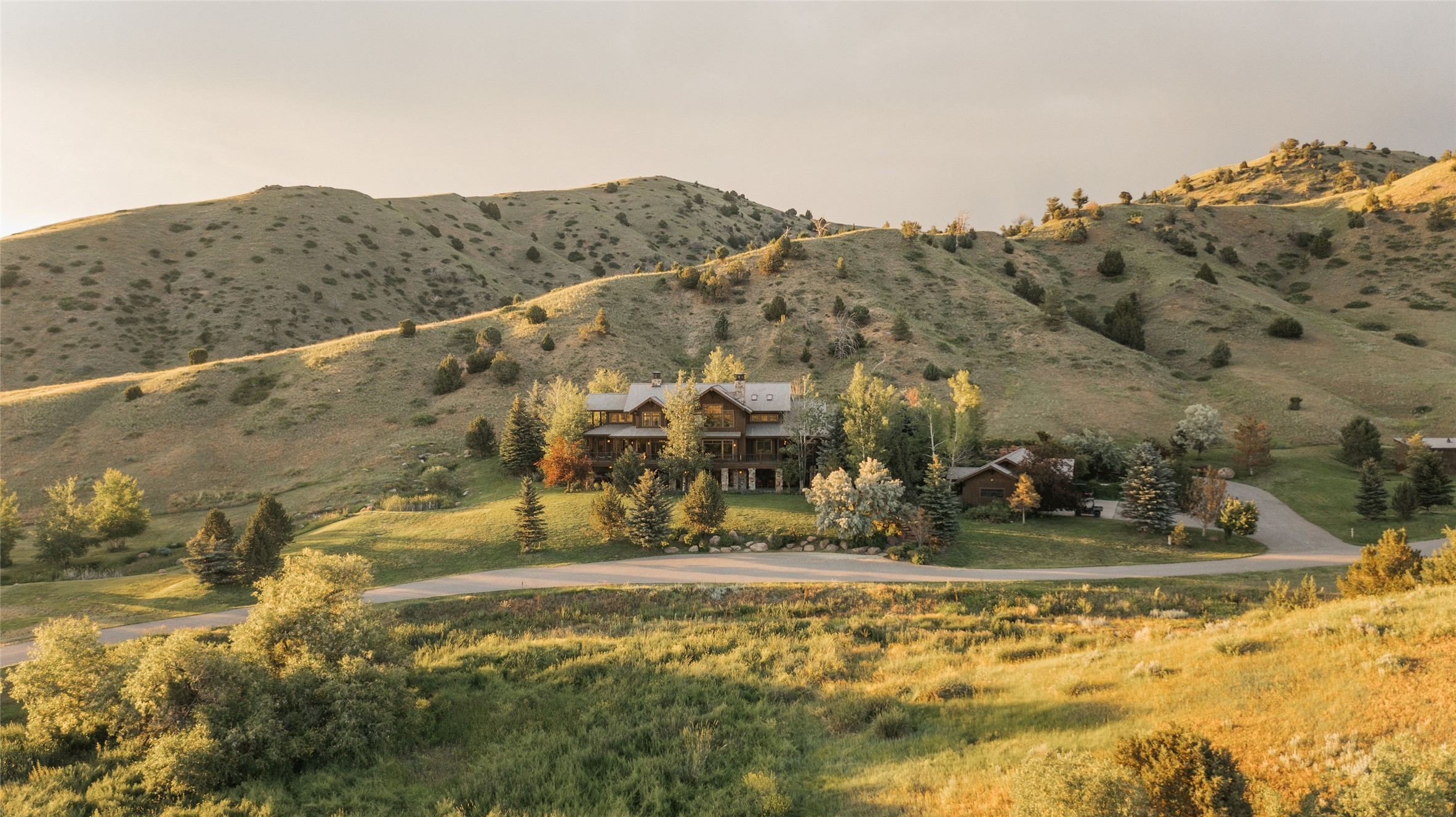~4,500 feet in elevation, the 6,220-acre (Apx # Acres Deeded: 5060) Grey Cliffs Ranch is situated on a varied landscape, featuring rolling hills, grasslands, and rangelands. Once upon a time, this property was a cattle ranch, when the property was purchased in 2003 the goal was restoration. Over time, native landscapes reemerged after planting thousands of acres of grasslands and trees, creating wetland protection with fencing to protect springs from livestock and reviving wildlife habitats for deer, elk, and upland birds including; wild sharp-tailed grouse, Hungarian partridge, pheasant, and chukar partridge. Two spring-fed trout fishing ponds are located on the property and the Madison River - Greycliff Fishing access site is a short drive away for additional recreational opportunities. The avid horseman can enjoy the indoor riding arena, and roughly 1,000-acre fenced grounds with running water for livestock. The property is currently farmed and watered by pivots. WATER RIGHTS CONVEY Apx # Cultivated Acres: 1184 
Apx # Acres Deeded: 5060
Apx # Acres Leased: 1160
Public Land Adjacent:  BLM, State
Crop/Crop Yield: Barley, Spring Wheat, Spr

 AS MUCH NOTICE AS POSSIBLE. MUST HAVE PRE-APPROVAL/PROOF OF FUNDS