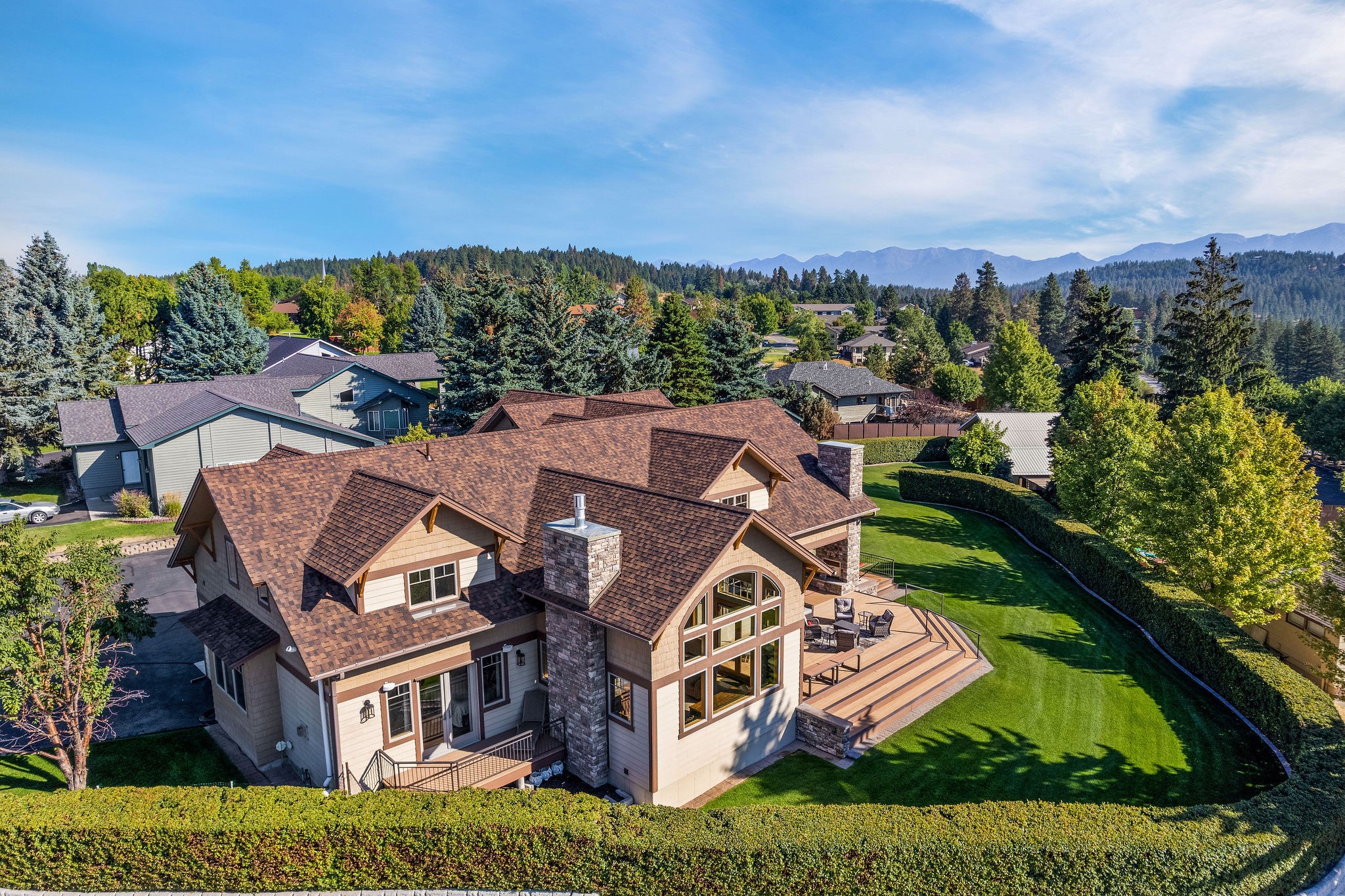 Introducing a Montana masterpiece w/ breathtaking Swan Mtn/Flathead Lake views! This extensively upgraded custom home on 1.15 acres boasts a spacious 6BD/7BA layout across 5,037 SF of living space, highlighting a main level living concept. New roof in 6/23! Immerse yourself in the warm ambiance created by the quality craftsmanship throughout! Indulge your culinary passions in the grand chef’s kitchen, complemented by a generous dining area that's perfect for gatherings. The covered entertainment/BBQ area, complete w/ its own fireplace, sets the stage for unforgettable outdoor evenings. Outside lies a meticulously landscaped yard w/ high-end privacy fencing, providing seclusion & peace. Park your boat/RV by the 1,404 SF shop w/ lots of storage/workspace. Stroll to the artisan village of Bigfork, where local shops & restaurants await. Flathead Lake's public beach/boat launch just minutes away. See Feature Sheet in docs. Call Jennifer Shelley 406.249.8929 or your real estate professional.