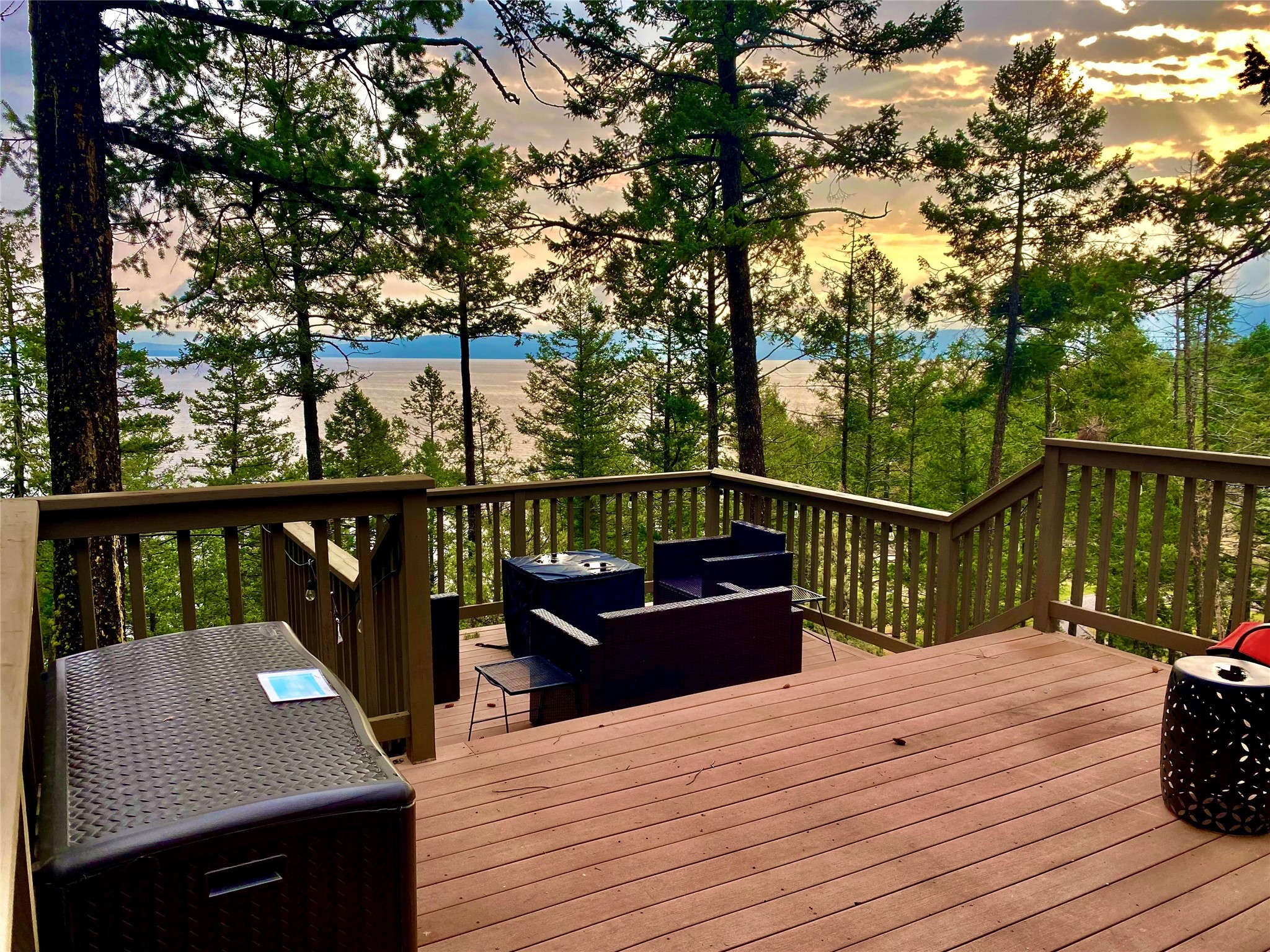 EXTREMELY MOTIVATED SELLERS!! Enhance your investment portfolio and invest in this magical cabin with incredible Flathead Lake views from a sprawling deck! The 1 bedroom, 1 bathroom cabin stuns with an open floor concept and custom cabinets in the kitchen. The large deck is comprised of Trex materials opening up to sparkling Flathead Lake peeking through the trees. The ideal location for a lucrative VRBO, this cabin is suited to store toys, boats, and vehicles in the large heated three-car garage. An adjacent lot is also available from the sellers that would be offered at a VERY REDUCED price if purchased alongside this property. The lot is MLS 30010628. Expand the land for which you have to roam and take delight in the private, tranquil point three miles from Lakeside. Play on the lake and enjoy fishing, hunting, and scenic drives all year long. Recreation is abundant so marketing a vacation rental is simple! A true gem, this mountainside wonder is turn-key with furnishings included! Local Area

 Lakeside, Montana clings to the shore of Flathead Lake along US Highway 93. The tourist town gives visitors access to the lake and gorgeous views of the Swan Mountains. Lakeside is a short fifteen-minute drive south of Kalispell, Montana and two hours north of Missoula, Montana.  

Experience the vibrant historic downtown district of Kalispell, Montana. Kalispell became a city in 1891. Community members donated silver coins to be melted down into a stake to mark the railroad and the town’s beginning. The railroad helped Kalispell thrive by bringing industrial industries such as farming, sawmills, and flour mills. The mountain town is situated in the center of the Flathead Valley and serves as an excellent base camp for those traveling around northwest Montana. The town has shopping, three golf clubs, restaurants, art galleries, and access to outdoor activities. 

Tucked into the bay where the Swan River flows into Flathead Lake, the charming town of Bigfork, Montana offers a resting place for tourists and lake-goers. The town has golf, fine restaurants, art galleries, and live theatre. It holds many titles one of which is “One of the 100 Best Small Art Towns in the Nation.”
 

Area Attractions
 

Flathead Lake 

Flathead Lake is a popular destination in Western Montana with over 200 square miles of water to kayak, boat, paddleboard, canoe, swim, fish, and recreate on. The vast lake spans 30 miles and measures a depth of 300 feet. It is the largest natural freshwater lake on this side of the Mississippi! Stop at one of the many roadside stands in the summer months to purchase fresh and locally grown cherries, apples, plums, and other produce. Cabins, campgrounds, vacation rentals, and hotels are scattered along the shoreline offering superb lodging. This hotspot is surrounded by the Mission, Salish, Swan, and Whitefish mountains making it a beautiful vacation destination. 

Glacier National Park 

The coveted area nicknamed the “Crown of the Continent” for obvious reasons offers gems and views of gold in the state of Montana. With over 700 miles of trails through pristine forests, alpine meadows sprinkled with bright lovely wildflowers, rugged and tenacious mountains, and spectacular sparkling lakes. Visit the historic chalets and lodges for a walk back in time or backpack, cycle, hike, or camp. While taking in the astounding sights of the glacier-carved peaks and valleys, set your binoculars on a diverse range of wildlife of bighorn sheep, mountain goats, deer, elk, ptarmigan, and both black and grizzly bears. This highway to heaven is a tough one to ever forget. 

Winter Recreation 

Whitefish Mountain Ski Resort 

The Whitefish Mountain Ski Resort is located in Whitefish, Montana on Big Mountain. There are over 100 trails on 3,000 acres of terrain. The vertical drop on Big Mountain is 2,353 feet and is served by 11 chairlifts, two T-bars, and a magic carpet. 

Blacktail Mountain Ski Area 

The Blacktail Mountain Ski Area is a tight-knit family-style atmosphere 28 miles southwest of Kalispell. The vertical drop is 1,440 feet served by 3 chairlifts and a rope tow. There are almost 30 trails with a vast majority being easy or intermediate in difficulty.