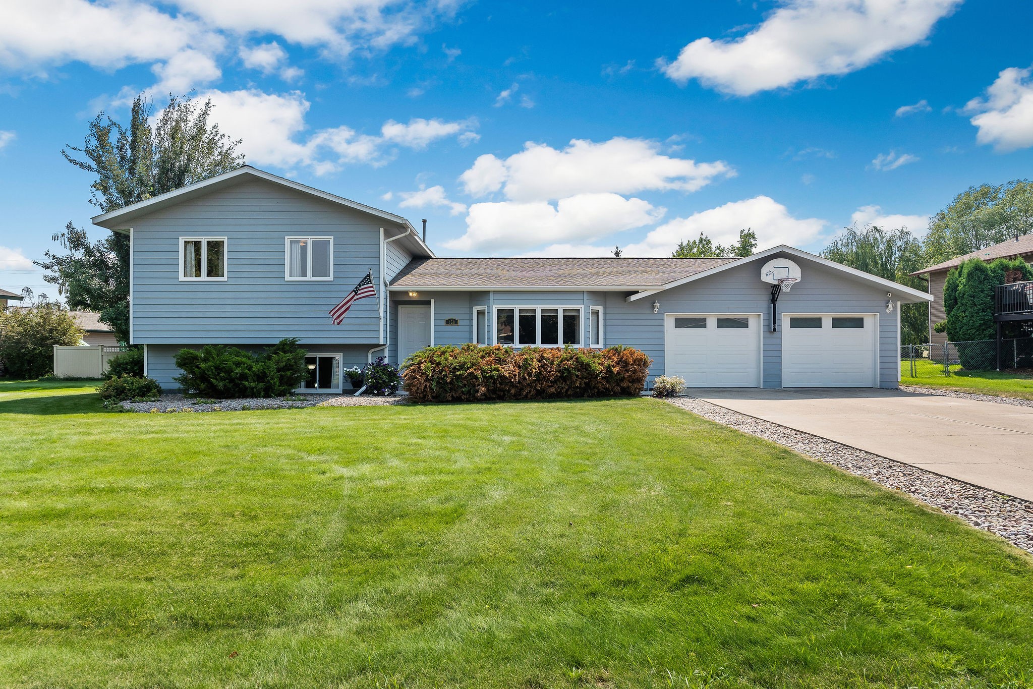 Look no further! This exceptionally well-cared for home sits in a beautiful, established neighborhood with prime location to Kalispell shopping and schools. Inside you’ll find gorgeous updates to the kitchen/living area including leathered finish granite countertops and modern laminate flooring. A complete remodel recently done to the main bathroom showcases a custom tile shower/tub  with a double vanity and LED mirrors. Two spacious bedrooms upstairs give you plenty of room for a king-size bed! Downstairs, enjoy a cozy den with gas fireplace, a 3rd bedroom, bath and laundry. The expansive backyard with mature trees, deck and patio is an amazing setting for BBQ’s and fun with family and friends. Newer roof and garage doors. Oversized crawl space provides ample room for storage. Call Jessica Sickler (406)261-2935 or your real estate professional today!
