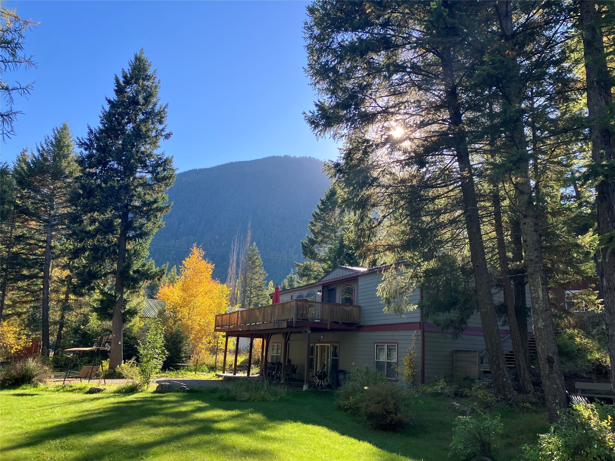 This two unit home is located just over 10 miles from Glacier Nat'l Park. The property is over a 1/2 acre and has lots to offer, with a lower 2 bedroom/2 bath unit accessed from the alley driveway and an upper 3 bed/2 bath unit. Both units have laundry and kitchens. There is also a spot for an RV with hookups. On the upper deck is a hot tub and a built-in storage area. Two ensuite bedrooms with walk-in closets, large rooms and lots of space outdoors. Only a short distance to the Flathead River and Hungry Horse Reservoir. Call Jamie Foster 406-309-0688 or your real estate professional for more information.