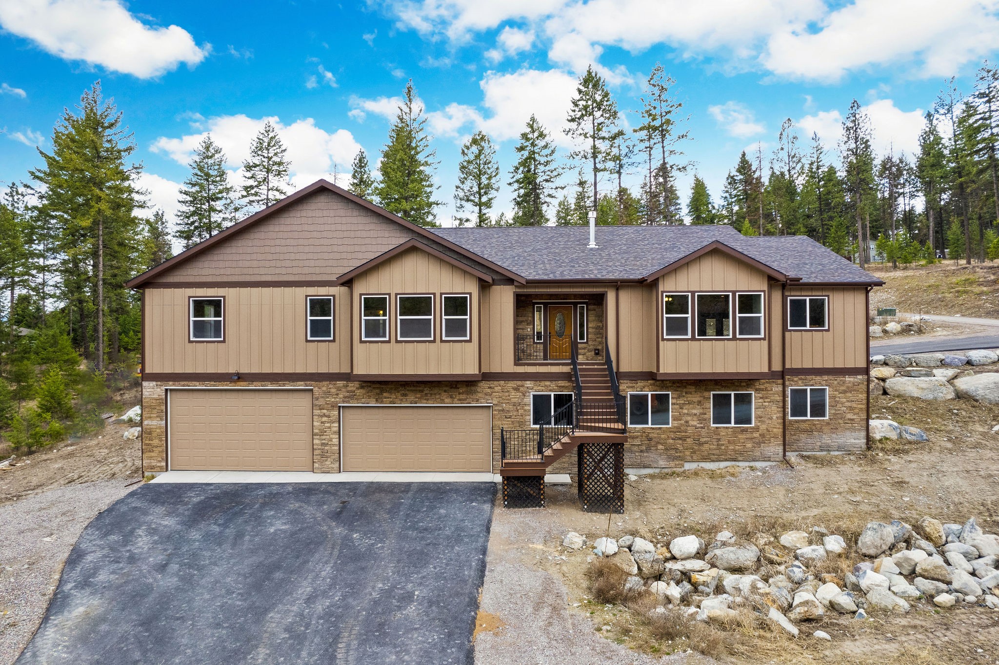 Beautiful 6BD/5BA 5,224 SF custom home under construction on 0.46 acres, minutes from Flathead Lake & Blacktail Ski Resort! The lower level features a huge 43'x46' garage, a great room w/ a wood stove, 3 bedrooms, a full bathroom, laundry room, & storage room which totals 1,535 SF of livable space. The 3,690 SF upper level features 3 bedroom suites, one w/ a propane fireplace; a kitchen w/ a 9 ft granite breakfast bar & Monogram appliances, a great room w/ a propane fireplace, an office, laundry room, powder room, a covered deck, & more! Central heat/air, two 50-gallon hot water heaters, & 1000-gallon propane tank included. Buyer has the opportunity to pick certain finishes & colors. Scheduled construction completion is Sept 2023. See Feature Sheet in docs for planned finishes & construction details. Interior photos available. Swan & Echo Lake, Glacier National Park, Whitefish Resort, Jewel Basin Hiking area nearby. Call Jennifer Shelley 406.249.8929 or your real estate professional.