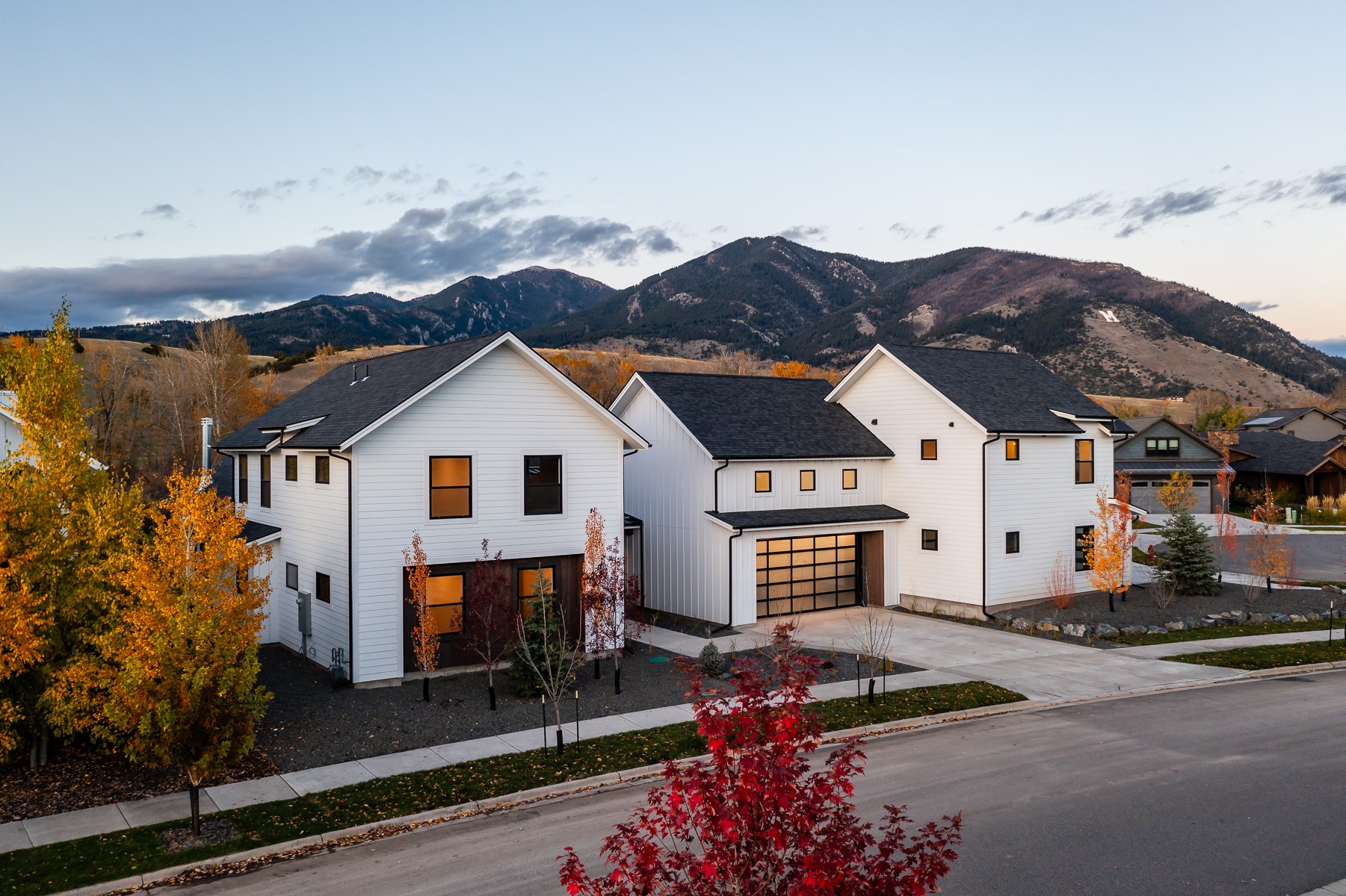 Experience the ultimate in Bozeman luxury in this stunning new construction home. Located in Legends subdivision on a 1/3-acre lot with top-of-the-line finishes. Backs to open space with trails. Architecturally designed + meticulously built, this home has a great floorplan: 4012 sq ft main house, a 1 bed/1 ba ADU + two 2-car garages. Solid surface flooring - European oak hardwood + tile. Wood cabinetry and quartz counters. Sound insulation. Thermador, Pella, Dornbracht, Toto. 16’ ceilings in great room - wood burning fireplace. Primary suite with 14’ ceiling. Primary bath w/ soaking tub, heated floor, steam shower. Each bed has ensuite bath. Flex/bonus room on 2nd. Laundry/mud room. 3 furnaces w/ AC. Landscaping w/ retaining walls, irrigation, perennials, trees, sod. Neighborhood trails link to parks, Bridger Creek Golf Course, downtown Bozeman, Bridger mountains + Story Mill Park. 20 mins to Bridger Bowl, 5 mins to dining, shopping + amenities. Don’t miss the 360 VR Matterport Tour!