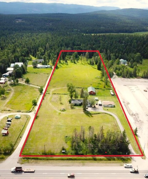 Dynamic location for this rare offering featuring 9.38 Acres just south of Whitefish with 2 homes and a large barn/shop outbuilding.  Current Zoning is Sag-5/Highway Overlay which allows for a multitude of residential and commercial uses. The back (west side) of the property features a gorgeous partially wooded and private area ideal for a custom home with stellar mountain views.  328 feet of Highway 93 frontage offers a high visibility setting in the front and the mid section is a flat pastured area set up for animals.  The main house is a 3 bedroom 2 bathroom ranch style home with a 2 car attached garage.  Guest house is a 2 bedroom 2 bathroom manufactured home with it's own parking and yard space.  Put on your thinking cap because this diverse property offers endless possibilities in gold mine location just outside Whitefish City limits.  For more info call Garth at (406) 212-0263 or your real estate professional.