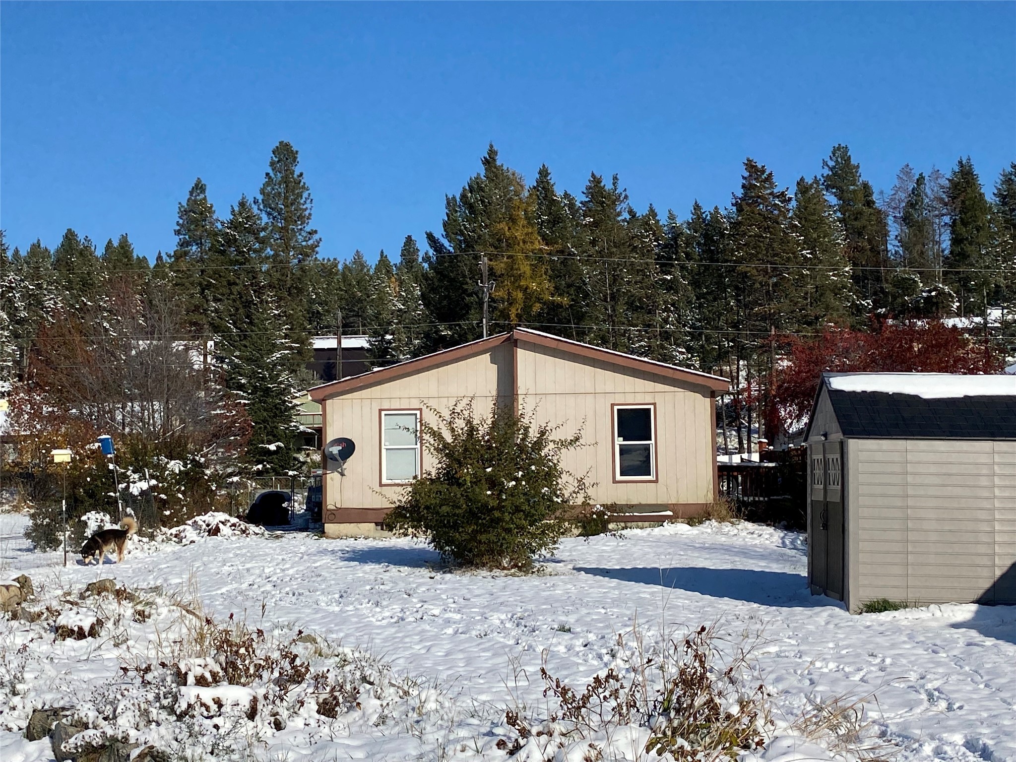Welcome to Lakeside Montana and this 3 bedroom 2 bath manufactured home on a spacious 0.25-acre lot. Located just 2 blocks from the Flathead Lake public boat launch, the Veterans Public park and walking distance to town.  This home is perfect for those who enjoy living near the lake with all of the small town ambience. The roof was replaced just 3 months ago and this home sits on a permanent foundation. New appliances, kitchen and bathroom fixtures, and carpet throughout in 2018. Hot water tank and electric furnace were installed in 2019. Don't miss out on the opportunity to own a great home with many of the essential updates. Call Alice Brotnov at 406-229-0120, or your real estate professional.