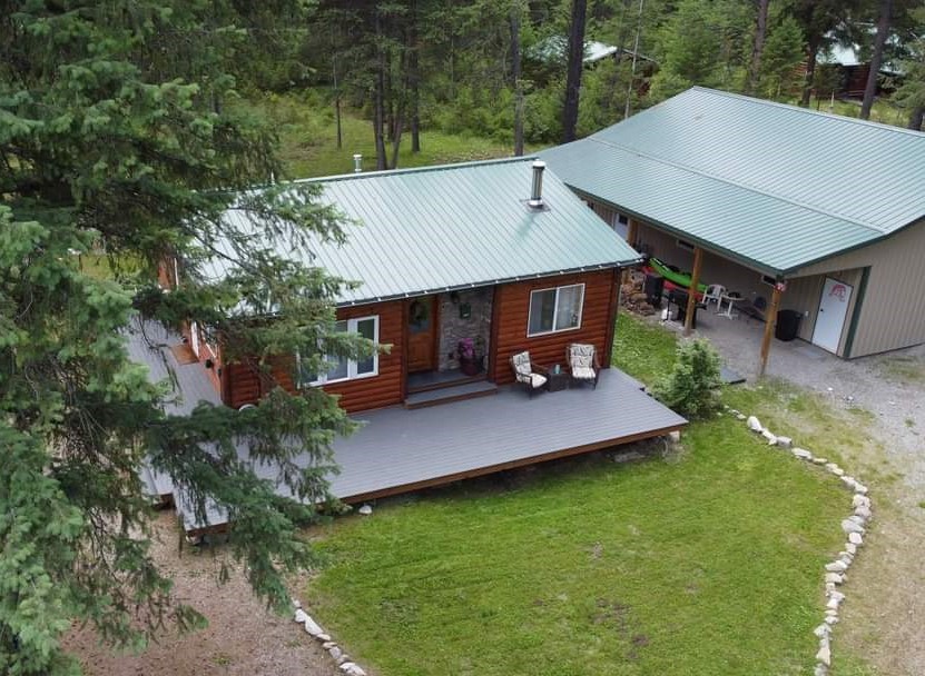 OFF GRID! Tastefully updated 1 bed 1 bath charming cabin with another 1 bed 1 bath guest living quarters in the back of a 30x40 propane/wood heated shop. All near the Clark Fork River and close to Quinn's Hot Springs Resort on 1+ acres. You will love the relaxing atmosphere, wonderful mountain views, and easy river access for recreational use of your choice. This cabin is well maintained and move in ready. This property can be used as a long- or short-term rental! Call/text Rebecca Kovarik 406-249-3719 or your real estate professional today for a showing.