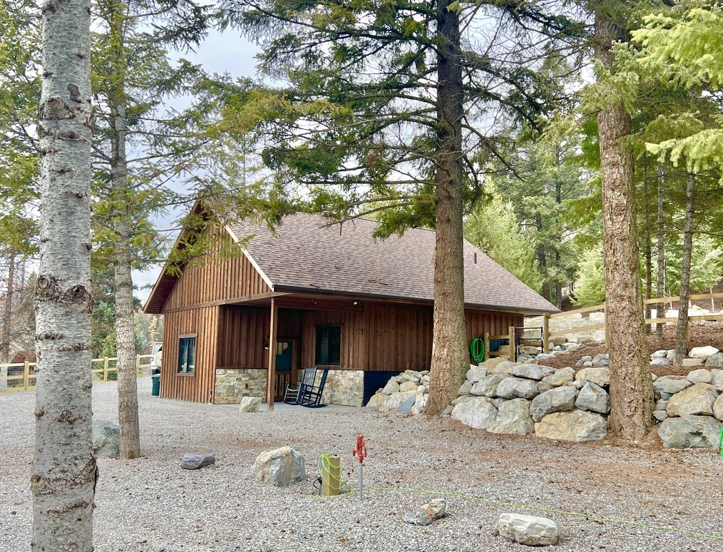 This amazing cabin located only a few minutes from downtown Whitefish will have you yearning to move in as soon as possible!  It offers so many amenities and great details, such as a beautiful open layout, custom kitchen cabinets, granite countertops, tile shower, high-end LVT flooring, radiant floor heat, an additional mini-split unit with A/C, on-demand hot water, 10' ceilings, and a lovely studio bedroom.  There is also a wonderful murphy bed for your favorite guests, and large windows to let the sunshine in.  Add to that a covered front porch, underground utilities, an owned and underground propane tank, ample parking with RV electrical plug in, water hydrant and septic dump, gorgeous fencing and a serene wooded view, and you have an incredible home and property that is all you could wish for.  Expanding the home is possible, as the septic system is permitted and built for 6 bedrooms! Call Carmen Hobson, (406)871-8760, or your real estate professional.