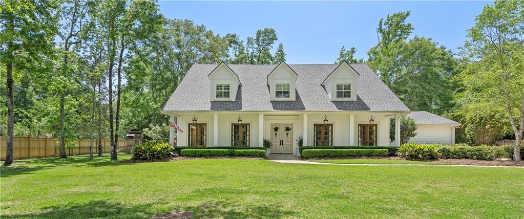 Lovely Acadian home on oversized lot in Tchefuncte Club Estates. Beautifully renovated in 2017! Fantastic floor plan & outdoor space for entertaining. Wonderful chef's kitchen w/ great storage & plenty of counter space, plus large & efficient laundry room.  2 additional bonus rooms upstairs with closets for any use possible.  Architectural appointments of beautiful French doors, cypress wrapped beams, brick floors, antique dutch door & the best double stairway leading to both kitchen & living room.