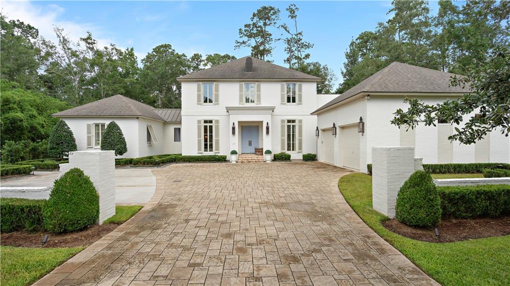 This classic & clean French inspired design features spectacular bleached & pickled heart of pine floors that brighten the entire house!  The open floor plan allows for easy flow & optimal entertaining. Large open kitchen flows into a wet bar area w/ a filtered water Hoshizaki ice maker & sink, 2 refrigerator drawers & a liquor pullout drawer.  Living areas adjoin the spacious back porch, pool deck & back yard.  The garage is air conditioned for added comfort. A must see! New roof! Whole Home Generator!