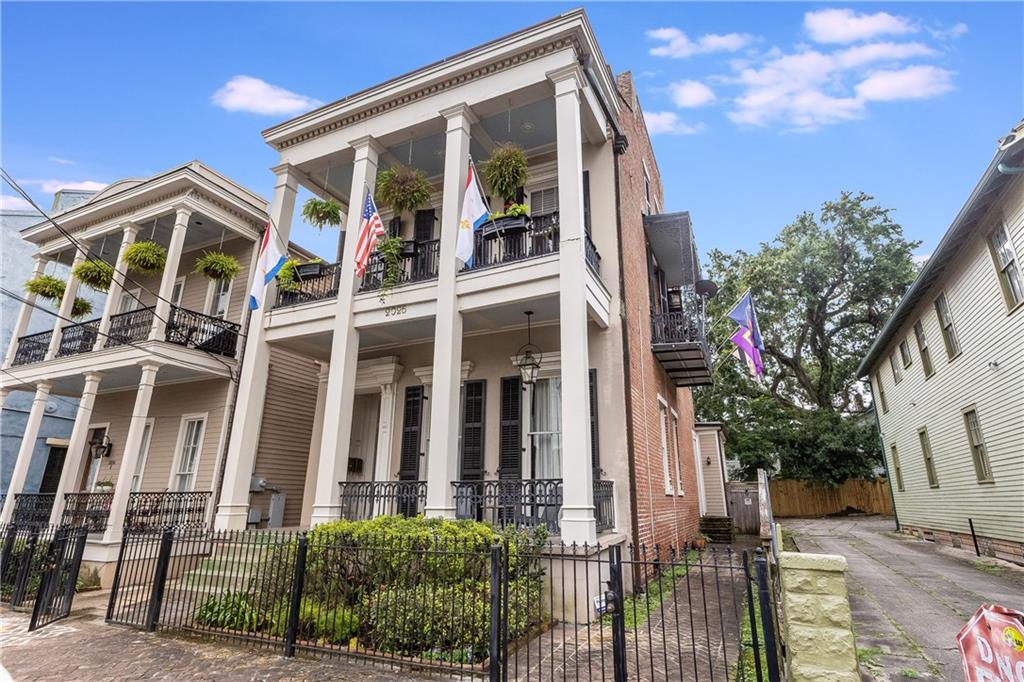 2 bds plus built-in office, Three story Double Gallery Townhome style with TWO Balconies, Original Exposed Brick Walls, Pine Floors, 12ft ceilings & several walk through windows.Located in the Historic Lower Garden District, an area surging in popularity due to its unique vibe, historic architecture, and proximity to the CBD/French Quarter/Uptown. One block to the parade route and Street Car on historic St. Charles Avenue! Close enough to stroll to the action but far enough back to tune it out!