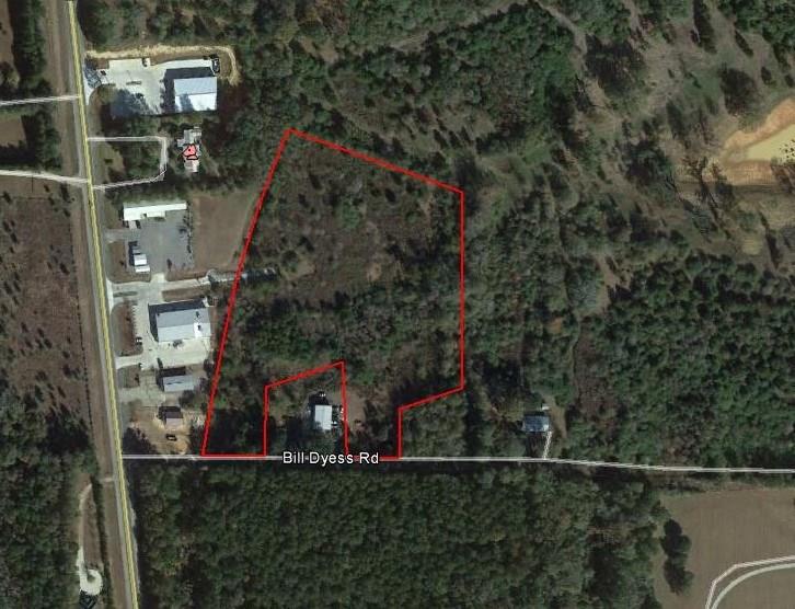 7.58 acres of Industrial zoned land in Folsom City Limits. Spectacular location just south of Folsom town center but getting all traffic that passes through town for high visibility. Property has access from Hwy 25 and Bill Dyess Rd. Access to electricity and city water at multiple locations at property.  Natural gas is at Hwy 25 and should be available but to be verified by buyer and/or buyer's agent. Property consists of 3 separate lots of record but owner wishes to sell as one parcel.