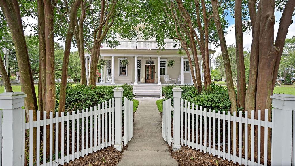 Designed and built in 1907 for the Dendinger family & registered on the Federal National Trust Historical site. This magnificent former home with high ceilings and wood floors on 1st floor is now converted to 15 offices, conference room, reception, and 2 1/2 baths. Great floor plan for offices but a variety of possible uses. Over 1.48 acres in the heart of Madisonville. 6 lots (a full square) with 365' frontage on Hwy 21. This is a must see property!