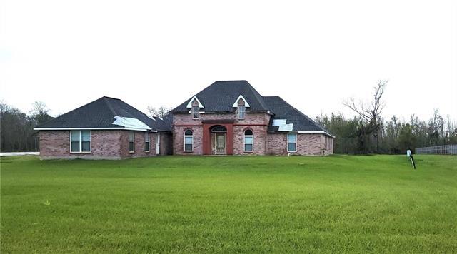 MAKE THIS YOUR OWN, CONSTRUCTION WAS NEVER COMPLETED ON THIS LARGE SPACIOUS HOME, THAT SITS ON 2 ACRES IN ST
CHARLES PARISH. HOME IS WIRED AND PLUMBED, SOME STORM DAMAGE FROM IDA. LARGE OPEN FLOOR PLAN, LARGE GUEST BEDROOM OR STUDY WITH IT OWN BATH, FORMAL DINING ROOM,HUGE MASTER SUITE WITH STUDY, THIS HOME IS AWAITING FOR SOMEONE TO COMPLETE IT. SITS ON 2 LOTS. SELLER WILL NOT DO ANY REPAIRS SOLD AS-IS, NO POWER OR UTILITIES IN THE PROPERTY. SELLER WILL CONSIDER A BOND FOR DEED