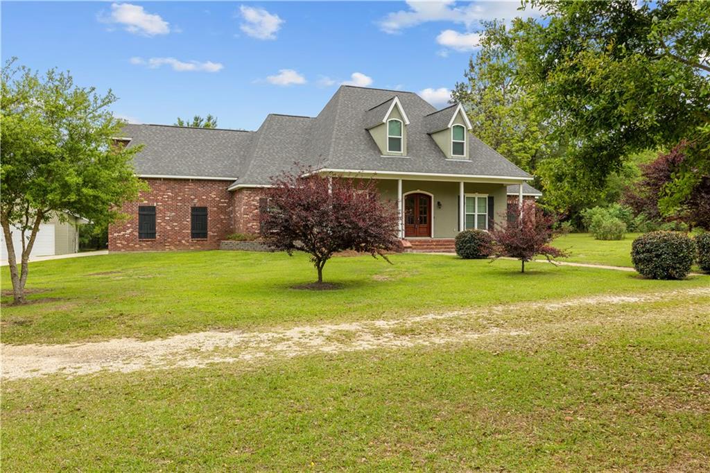 Country living at it's finest! This custom built home is situated on 5 park like acres. New roof! Updated wood floors throughout. Large 24x36 shop w/kitchen and sep. restroom. 4 bedrooms with add. office or 5th bedroom. Spacious kitchen with custom cabinets and large breakfast area overlooking your beautiful backyard. Wood burning fireplace and built-in in the living area. The primary bath includes jacuzzi tub & newly renovated walk-in shower with steam room feature. Large bonus room upstairs! A must see!