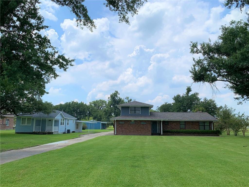 This listing includes 2 separate houses, one at 12625 River Road and 12621 River Road, an extra large metal garage that is 1350 sq. ft, a brick garage with 2 garage doors, a built in swimming pool and pool house, on over 3.6 acres of beautiful land. The brick house (12625) is 2494 sq, ft. with 3 bedrooms and 2 full baths, a study, large den that can be a primary bedroom, living room and sunroom, very large laundry room. Attached carport that fits at least 3 cars. The roof was replaced after Hurricane Ida. The second house(#12621 River Road- Blue house on left) is 1077 sq. ft. of living area. 2 bedrooms and one full bath, living room, and large kitchen, extra room and laundry room and has had some renovations done. Could probably be rented out for at least $1200 per month. Behind the blue house is a very large metal building that measures 45x30 (1350 sq.ft.) with 2 large garage doors. would be good as workshop or to house cars. There is another brick garage/workshop that is 35x12 (420 sq.ft.) There is an inground pool and a pool house that needs some TLC. Both properties have separate addresses but sellers would like to sell as one package. Not many places in the area where you can buy over 3 acres of land. The measurements are 50.35/50.76x1043.3/1040.3 (1.2 acres) on the left with blue house, 100.70/101.52x1049.3/1046.3 (2.43 acres) on the right with the brick house. From River Road to the tracks and from utility poles on left side to fence on right side. Dimensions and answers to questions on this listing pertain to the brick house.