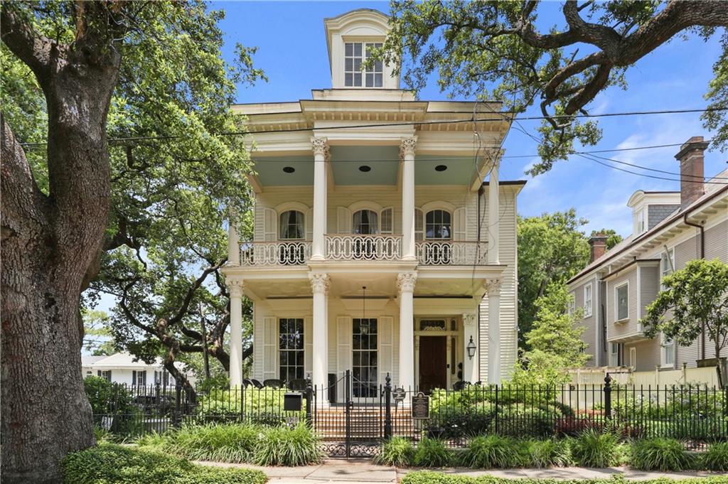 This grand Uptown home is a magnificent and handsome Italianate-style double galleried side hall mansion, built in 1868 by famed New Orleans architect James Freret for a well known New Orleans family. Originally facing St. Charles Avenue, the home was moved to its current location in the 1890s and sits prominently on a spacious corner lot which allows for beautiful gardens and courtyards, along with a 3 car garage and a detached 2-story guest house. The main house was completely restored to its original grandeur in the late 20th century and has been meticulously maintained and updated ever since. The 1st and 2nd floors boast 14 foot ceilings, and gorgeous original details. The layout allows for multiple living areas including double parlors used as formal living and dining rooms, a large den with wonderful built-ins, and a glassed sunroom. A large gourmet kitchen boasts ample storage and high end appliances. The home flows naturally to the oversized covered porches, making entertaining a breeze. Upstairs on the 2nd floor are 4 bedrooms and 4 full bathrooms, including a large primary suite with a huge bathroom and separate walk-in closet. There is also a large laundry room and two covered porches (including one that is screened) on this floor. The 3rd floor has high ceilings and 3 additional bedrooms plus 2 more bathrooms and a cozy den. The rear courtyard with fountain and mature plantings connects the main home to the garage and the detached 1 bedroom guest house. There is a separate garden powder room for outdoor entertaining. The yard is extremely large and could easily accomodate a pool. The guest house is separately metered and has a private entrance from Carondelet Street. Recently this guest house has been used as a very successful short term rental, bringing in $25k to $30k per year in revenue. With the charm and grace of yesteryear but all of the modern conveniences one would expect, this home seamlessly blends the best of old and new!