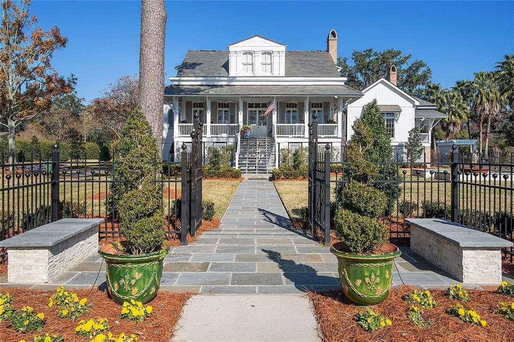 Built in 1849, this exquisitely restored historic home is set on a 1.10 gloriously landscaped acre lot on Lake Ponchartrain. 12 foot ceilings, hard wood floors, elevator, pool and custom built addition beautifully blends with the existing home. Pristinely renovated guest house and brand new slate roof is the crowning touch to this picturesque property with postcard views.