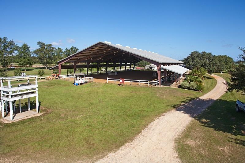 Serenity Farms, 30 acre high and dry equestrian show facility. 25,000+ sq. foot covered arena, 2 open show arenas with Judge's stands, show barns, concession stand. Additional oak filled acreage is available.