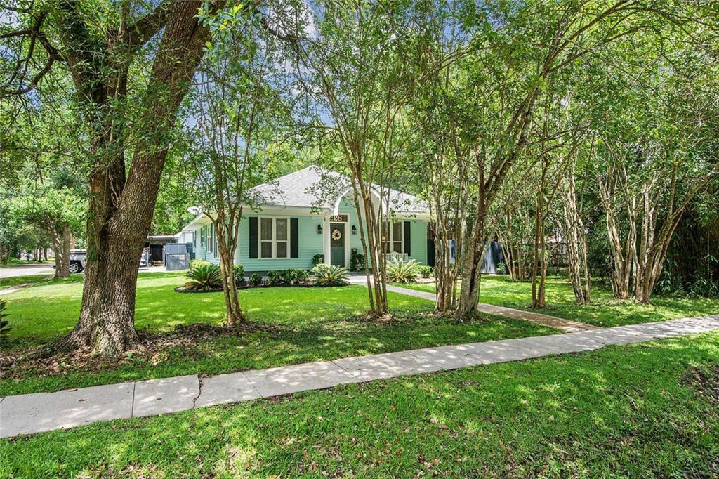 Charming renovated cottage on a corner lot in the heart of old Covington. Kitchen opens to den and all overlook covered back porch and pool. Separate air conditioned studio being used as an office with additional shed for equipment. Third bedroom could be used as an office. Covered area being used for storage and parking. Beautiful grounds and you can walk or bike to downtown Covington's numerous shops, restaurants, and festivals.