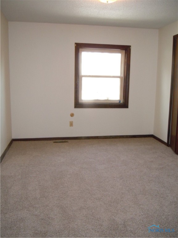 Bedroom with new carpet.