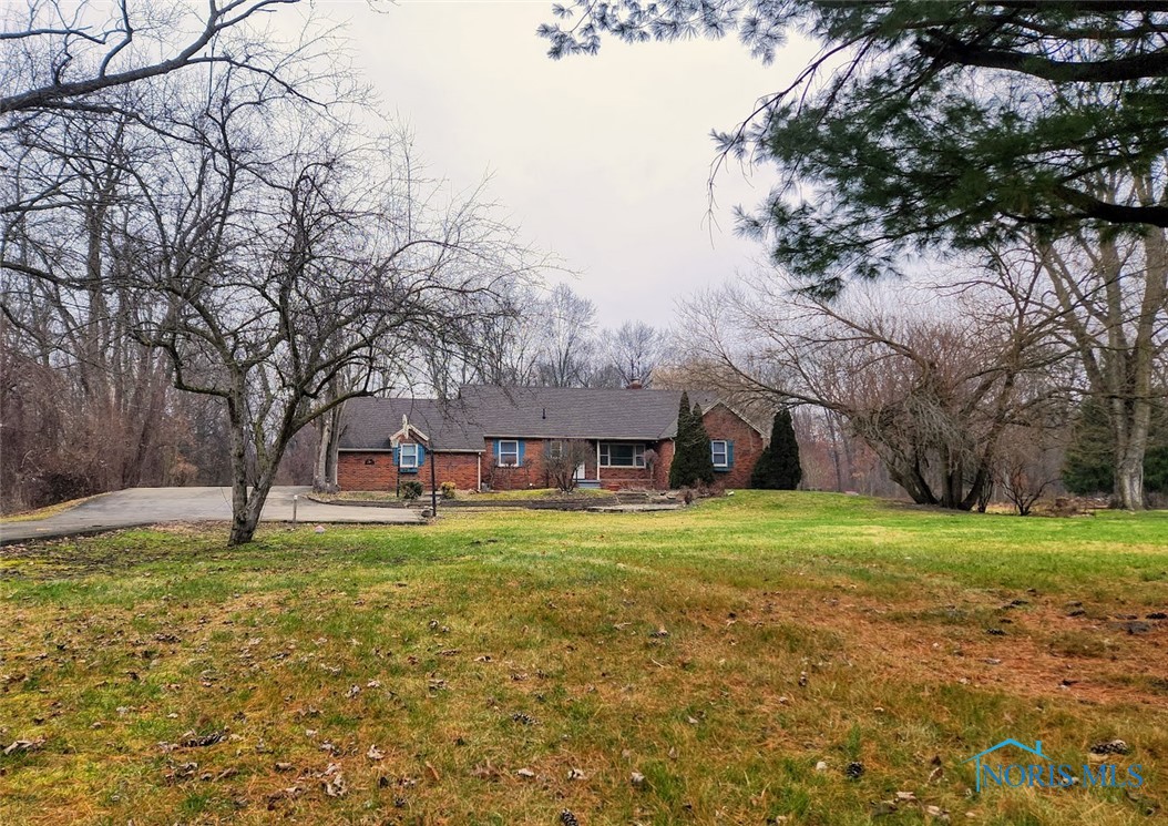 Welcome Home, Springfield Schools. Sitting on 5 acres, mostly wooded.  Everything you could want in a home! 4bed, 3.5 baths, living room w/fireplace, full finished basement with 35x14 rec room w/bar, and 24x31 family room w/fireplace, making total 4200sqft of living space! Formal dining room, kitchen with eat-in, sliding doors to your 17x22 sunroom, walk out to your 14x12 deck, overlooking your serene park like setting, secluded, watch the deer and wild turkeys, and much more.
