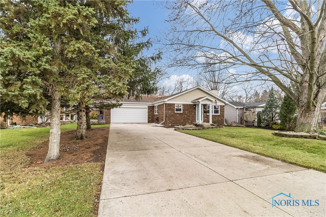 Plenty of updates & charm in this brick Perrysburg home. Sitting across from the municipal park & pool & walking distance to Toth Elem, this home has been well loved & maintained. Updated eat-in kitchen w/new counters & beautiful refinished cabinetry. All HW flooring on main floor refinished this year. Updated full bath w/new tub & flooring. Liv Rm features WBFP & shelving on either side. Super nice Fin. Basement adds a huge amount of sq. footage to your living space inc. 4th BR, liv. rm, office & full bath. Quaint rear yard features enclosed porch. Double hung windows. Possession negotiable.