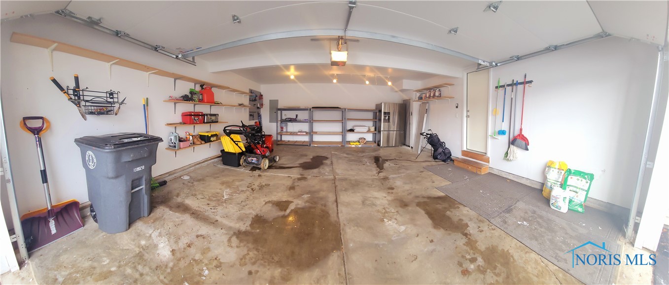 Insulated, finished garage with organizers, tons of shelving! New garage door.