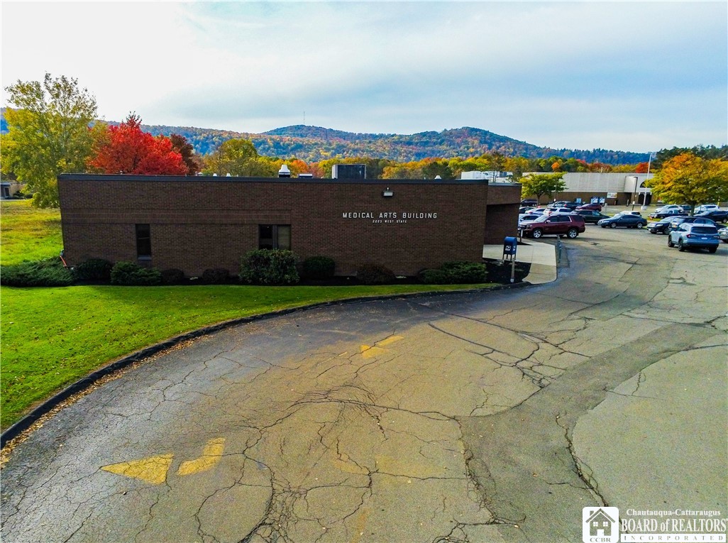 Discover an exceptional commercial opportunity at 2223 West State St, where two meticulously maintained buildings offer 25,660 (16,660 in one and 9,000 in the back building) square feet of versatile space in the heart of Olean's thriving business district. This 3.36-acre property boasts modern amenities such as forced air heating and central air conditioning, ensuring year-round comfort. Ideally located just minutes from major retailers like Wal-Mart, Home Depot, Chipotle, and Marshall's, and adjacent to Top's, this single-story setup promises easy accessibility and high visibility.