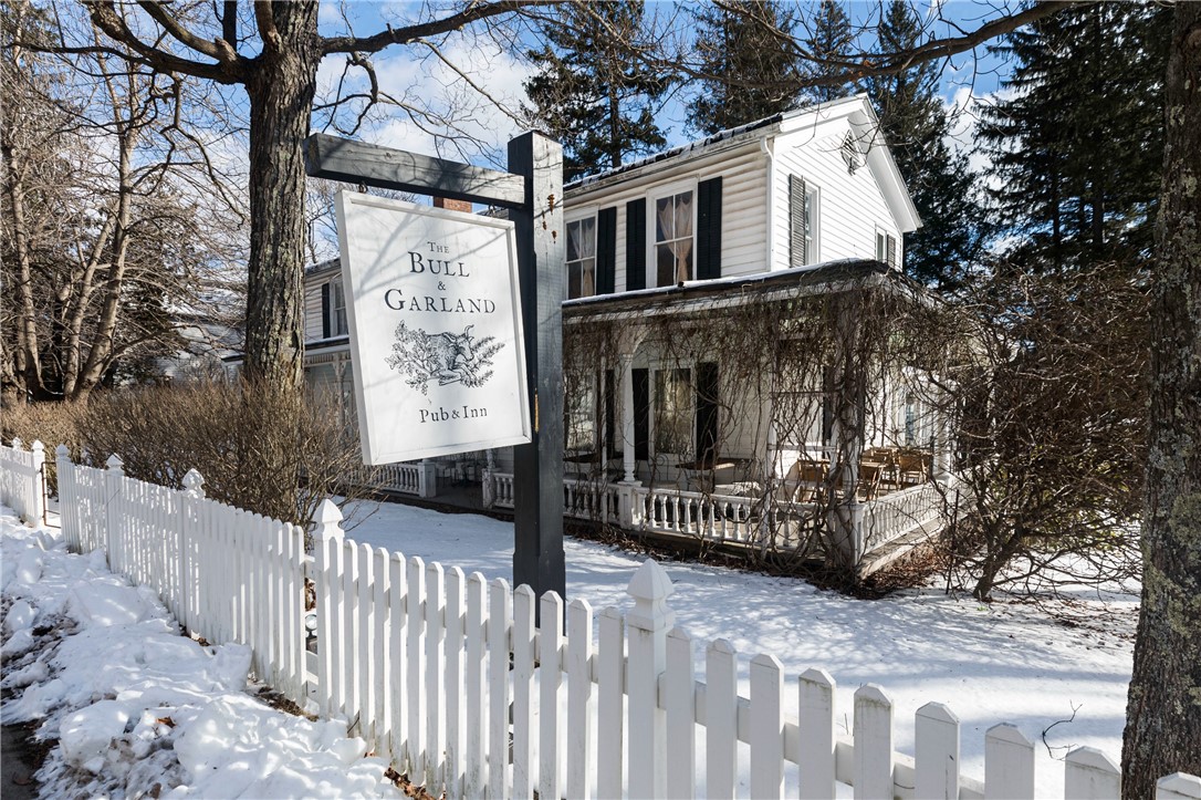 Located in the heart of the picturesque Catskill "book village'' of Hobart, this profitable and well-regarded boutique inn and gastropub is ready for its next proprietor. Bring a new vision to the many opportunities this property offers including five well-appointed guest rooms, a pub with a fully-equipped commercial kitchen, a beer garden, and multiple outbuildings. The main building, built in 1890, was renovated and converted into a restaurant and inn, still maintaining all of its historic charm. A breezy, wraparound porch with additional restaurant seating leads into the reception area, bar, and dining room that seats approximately 55 customers. The ground floor also includes two spacious, fully-furnished guest rooms with private entrances. Upstairs are three more furnished guest rooms (each with their own bathroom), a laundry/utility room, and storage. Surrounding the property is an acre of land a mix of open yard, shaded areas, and water frontage on the West Branch Delaware River giving guests a sense of peace and nature while still being in a walkable village setting. Outbuildings include a barn with new flooring (perfect for events), an adorable old schoolhouse, and shed.