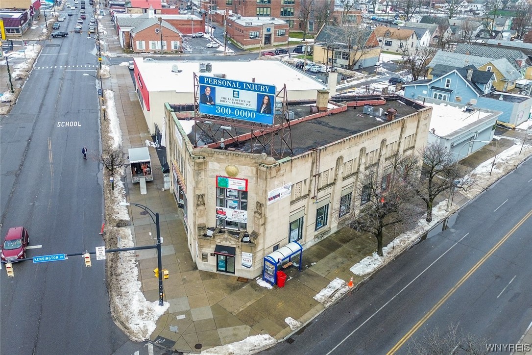 The former Kensington-Bailey Branch of Liberty Bank at 3065 Bailey Avenue (corner Kensington Avenue). Like most of the buildings designed for Liberty by the local firm of Dietel & Wade, this is an exuberant example of the Art Deco style of architecture, with geometric ornamentation and very highly stylized Classical details abundant. The building was completed in 1929 and remained in service as an active bank branch until the early 1980s. This historic parcel boasts over 10,000 square feet of commercial, office and retail space.  Current tenants are Liberty Mattress, Lamar and a restaurant.