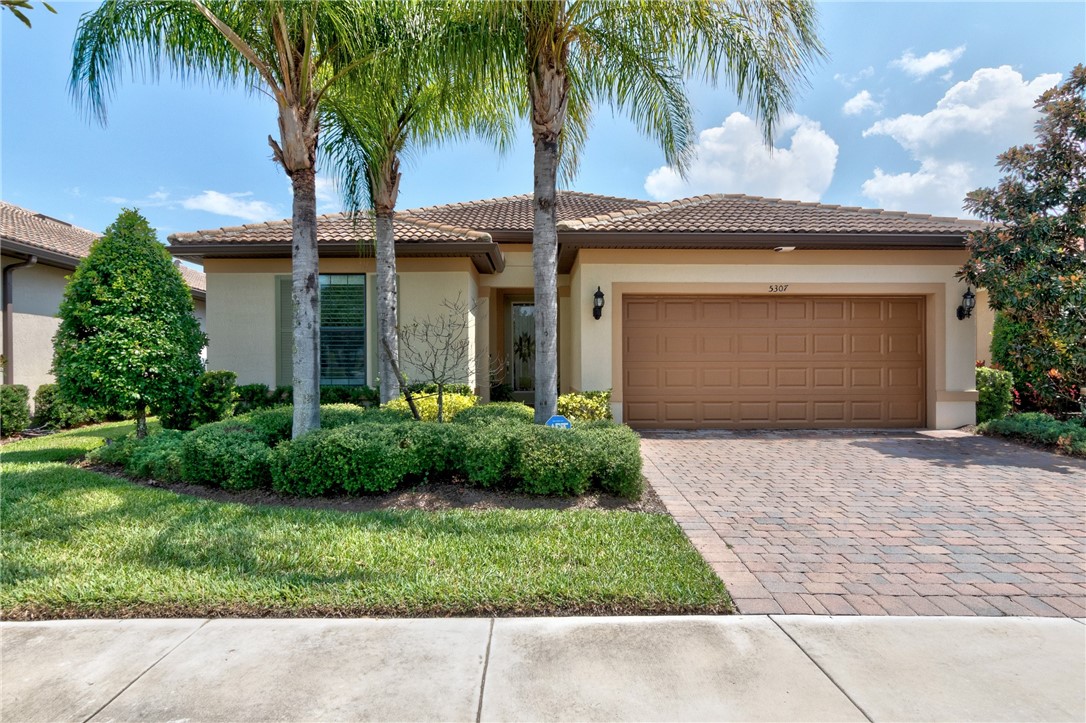 This beautiful home has upgraded Kitchen Aid appliances, top hat lighting, upgraded tile thru out home. plantation shutters, extended lanai, crown molding, paver driveway and patio the list of upgrades is to long to list. Make your appointment today you won't be disappointed.