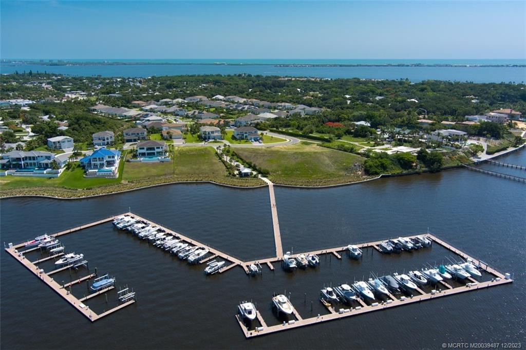 Experience Florida Living at its Finest in this 2021 built concrete block pool home with an elegant, well-appointed interior & space for everyone! A 30' boat slip is included with this rare opportunity to live in one of Martin County's most desirable waterfront communities perfectly located close to beaches, shopping, excellent restaurants and proximity to downtown Stuart and Jensen Beach.  4 bedrooms plus a sizable loft on the second level provide a clear separation of public and private spaces.  The main level offers a fantastic open plan with a formal dining room, separate office (or 5th bedroom), a great room and stunning kitchen featuring views of the gorgeous pool & spa, landscaping and preserve.  The sizable stone deck provides the ideal setting for outdoor entertaining or relaxing in the sun. Don't miss out & see what makes Langford Landing so special!