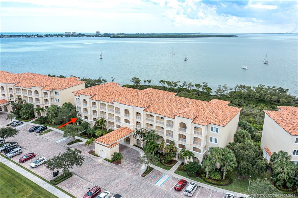 New price and New Air-conditioning system!  Enjoy wide-water views of the Indian River at this second floor, end-unit, 2 bedroom/2 bath condo in Harbour Isle.  Enjoy an active island lifestyle, then retreat to your private waterfront oasis at the end of each day...truly the best of both worlds!  This spacious condominium  (1,989 sf) has open living-dining area and light-filled Florida room; perfect for watching passing boats and wildlife.   End-unit has additional privacy thanks to no common walkway past the entry door. Owner’s suite boasts water views, en-suite bathroom with dual vanities and separate shower & tub. Bonus room can be 3rd bedroom, office or whatever you desire.  Solid concrete construction includes impact windows & doors, sprinkler fire system and 10’ ceilings.   Resort-style amenities include marina, clubhouse, pool, fitness center, tennis, bocce and dog park.  Parks, restaurants, beaches and downtown are just minutes away.