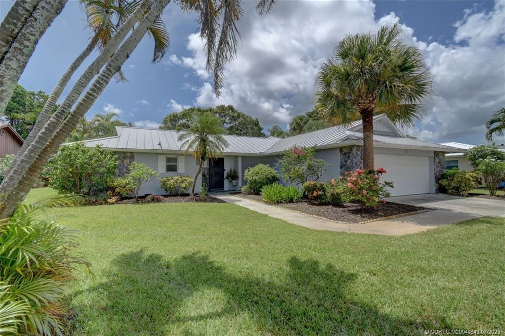 1,832 Sq Ft of pure Paradise. This 2 Bedroom, 2 Bathroom House has a 2019 AC, 2015 roof, huge Lanai, backyard and 2 car garage. The whole house has been upgraded and feels so spacious (2,526 Sq Ft.). Come "Live The Dream" and join the very Active Community of Conquistador Estates with tennis/pickelball and shuffleboard Courts and a Fishing Pier on the Saint Lucie River. The resort-style clubhouse has a large ballroom (with Kitchen), card rooms, exercise room and Library. This Community also has a workroom for those that enjoy woodworking, carpentry, etc. This house is spectacular!