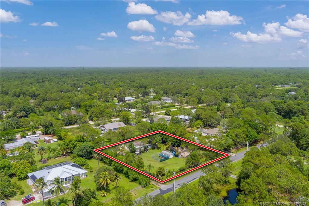 BEST BANG FOR YOUR BUCK IN JUPITER FARMS! Packed with potential, here's your opportunity to get into the Farms! Nestled in the midst of a charming equestrian community is your chance to escape to peace & quiet and an abundance of outdoor space for better family living. Great location! Great neighborhood! Located on a paved road - w/OVER 1 ACRE OF LAND - your opportunity awaits! 2023 NEW A/C. Excellent Jupiter schools! Easy access to I95 & FL Turnpike plus only mins to the heart of Jupiter & beaches. Enjoy Jupiter Farms' favorite neighborhood gathering spot Taylor Farmhouse Cafe. Don't be surprised if you see people showing up on horseback for their delectable fresh, homemade food! Go have fun at nearby Riverbend Park w/over 600 acres, walk & bike trails, river for kayaking, paddle boarding & fishing, picnic areas + much more.