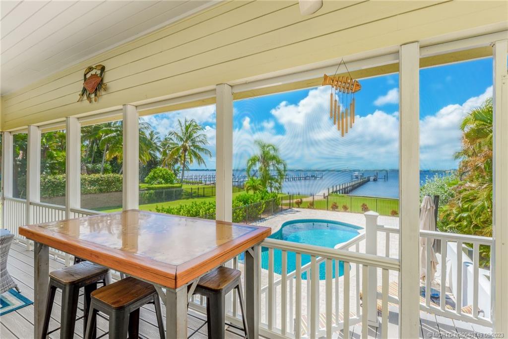 SPECTACULAR WIDE RIVER VIEWS! DEEP WATER ACCESS! Discover an oasis of serenity overlooking the St. Lucie River and Downtown Stuart. The main residence offers 3 beds/2 baths/2 car garage, screened porch overlooking both the pool and the river, and substantial dockage including a 16k lift, 40x20 wet slip, and additional lift piles for permitted 24k lift. Located above the garage, a charming guest suite with 2 bedrooms and 1 bath awaits, offering a versatile space that can cater to children, a boat captain, or caretaker. Nestled in a setting of privacy, surrounded by multimillion dollar estates, this home offers a rare sanctuary. Seize the opportunity to live a waterfront lifestyle without the constraints of an HOA and with the convenience of being near both vibrant Downtown Stuart and Jensen Beach. Whether a year-round residence or a seasonal escape, the waterfront lifestyle awaits! Recent Improvements List attached as Supplement.