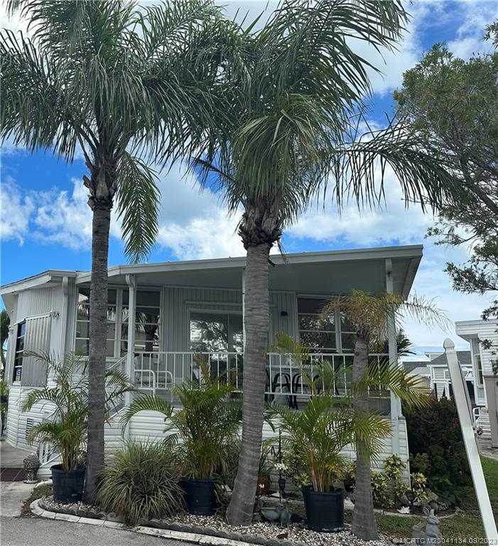 WELCOME TO PARADISE~~~A GREAT OVERSIZED COVERED PORCH, PERFECT FOR ENTERTAINING FAMILY AND FRIENDS, HUGE 1250 SQUARE FOOT BEACH HOME SITTING ON A 2890 SQUARE FOOT CORNER LOT. GIANT OPEN FLOOR PLAN, LARGER KITCHEN, 3 BEDROOMS AND 2 FULL BATHS.