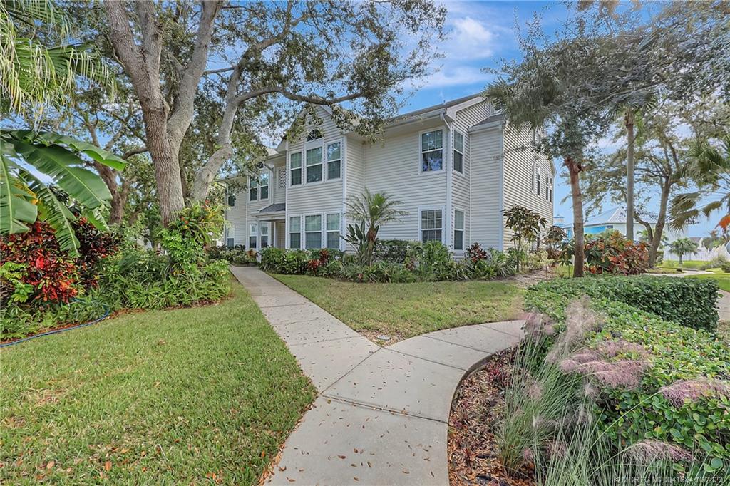 First Floor End Unit with Lake View, renovated with new floors, new fans, new lights, new locks, new paint and more...