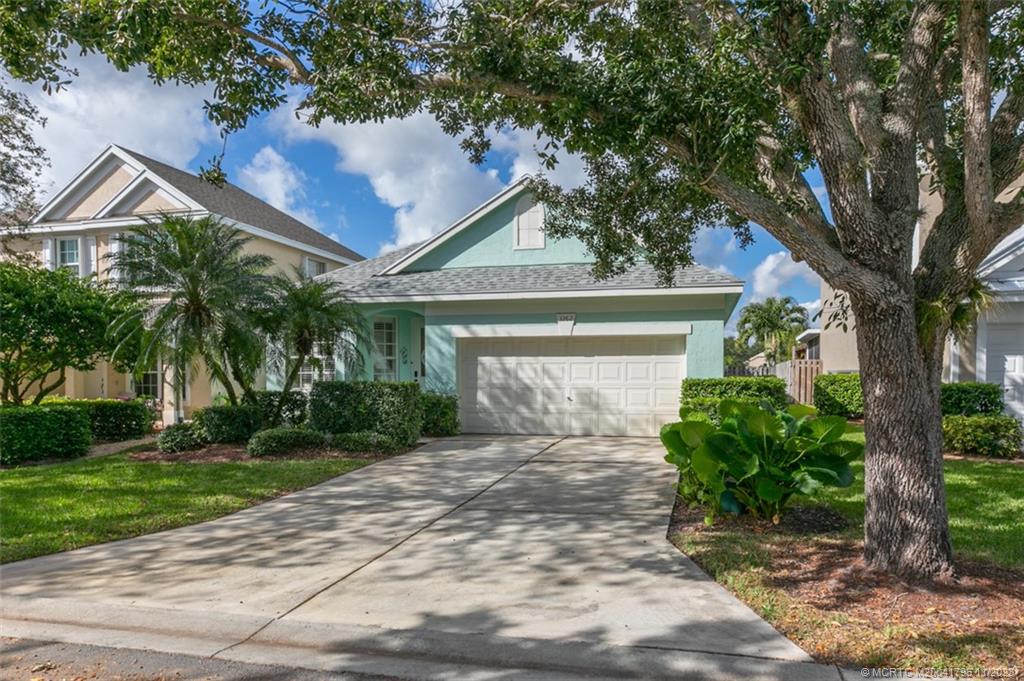 This True 4 Bedroom, 2 Bath, 2 Car Garage, CBS, Contemporary plan w/vaulted ceilings in desirable Palm City "shows like a model"! It has been completely updated from the new (2023) porcelain "wood look" tile throughout.. kitchen w/stainless appliances, granite counters/breakfast bar.. fully remodeled master bath featuring a free standing soak tub.. updated 2nd bath/vanities, etc.. spacious family room off kitchen opens to 8x16 under roof patio with added 10x20 screened patio offering serene lake views, fully fenced-in side yard ideal for kids/pets! Meticulously maintained.. New Roof 2022, newer A/C, newer appliances, etc. Community Amenities include pool/cabana, tennis/pickleball, basketball. All this on premium cul-de-sac, lake view lot! Palm Pointe/Palm Isles in Palm City, is a community for all ages offering A Rated Schools, easy/convenient access to I-95, Turnpike, variety of local restaurants, shopping & only minutes to Downtown Stuart & beaches.(Furniture Available & Negotiable)