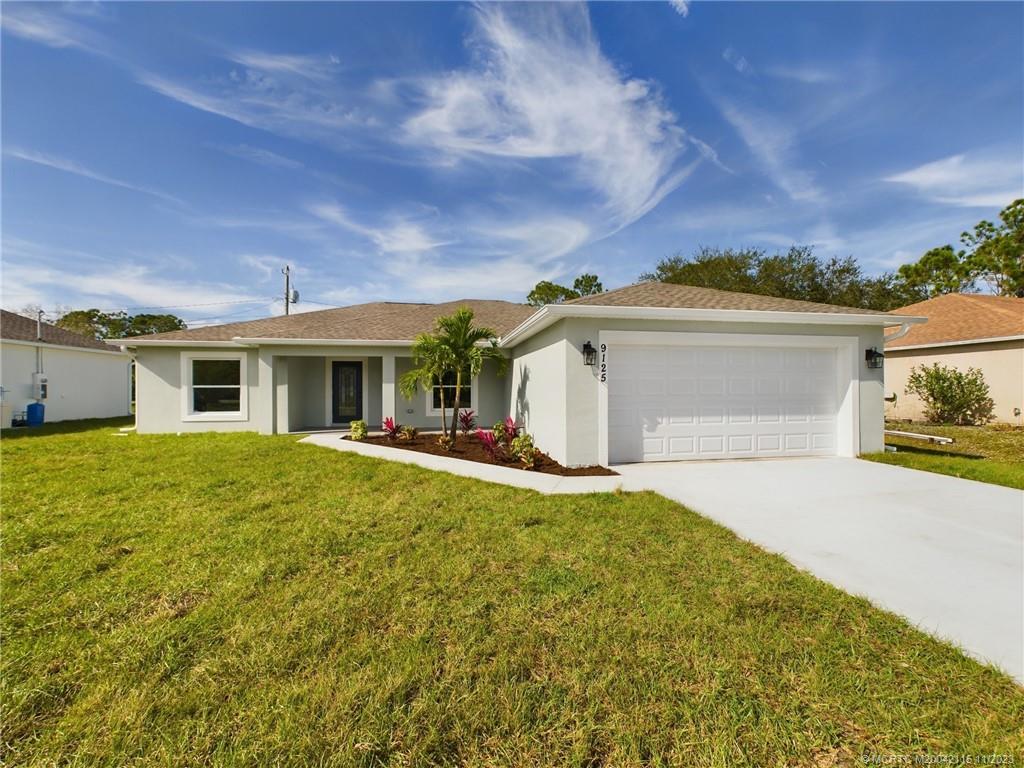 Lovely open floor plan with split bedrooms. Matching quartz in kitchen and baths, tiled showers in both master and guest showers, soft close cabinets with hardware & IMPACT windows/sliders. This home is move in ready! Conveniently located close to I-95, this is your opportunity to live in Paradise! Less than 10 miles to gorgeous beaches!