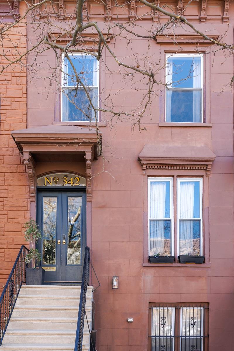 This 1870's Brownstone is located on a beautiful tree lined block in Brooklyn's expanded historic Stuyvesant Heights district. Reimagined and impeccably finished, 342 Decatur Street offers the perfect blend of architectural craftsmanship combined with contemporary and functional upgrades. This stunning ' Altered French Second Empire' style 2 family home is currently configured as an owners triplex with a finished basement on the lower level and a floor through one bedroom apartment on the top floor. Built 16.67' x 38' on a 100' lot , this breathtaking home which was featured in RUE magazine is guaranteed to impress even the most discerning home buyer. The owners triplex consists of an open space layout with a formal living/dining, area, 3 full bathrooms, 3 bedrooms,  a finished basement/gym/ rec. room and an eat-in kitchen featuring stainless steel appliances, custom kitchen cabinetry, state of the art LED lighting, herringbone white oak floors  &  La Cantina sliding glass doors leading out to the back patio and landscaped backyard. The sliding glass doors have been outfitted with custom remote control privacy / sun shade from The Shade Store.  The bedrooms all have high ceilings with medallions, decorative moldings and spectacular marble fireplaces with gel fuel birch log inserts. The master bedroom features a huge walk-in closet with custom Elfa closet system, while the second bedroom on the parlor floor has custom built-in bookshelves and cabinets. An enclosed glass walk-in shower with rain showerhead, a large soaking tub by Blu, elegant matte black bath fixtures and Moroccan tile floors are just some of the highlights in the luxurious master bath.Some additional features of this amazing property include: updated electrical & plumbing, high efficiency tankless hot water system, high efficiency heating and cooling systems on all floors, smart thermostat systems with sensors and custom ironwork railings throughout, high efficiency extra-large washer / dryer and additional storage in the finished basement / rec. room area.Comfortably entertain family and friends indoors or take the party outdoors onto the custom blue stone patio and the perfectly manicured backyard with a waterfall style deck  [with electrical outlets] in the rear.  Conveniently located close to Fulton Park, the A express & C trains at Utica Avenue and all your neighborhood favorites like Chez Oskar, Mama Fox, Trad Room, Saraghina, Milk & Pull, L'Antagoniste, Therapy wine bar and Nana Ramen.Showings by appointment only !