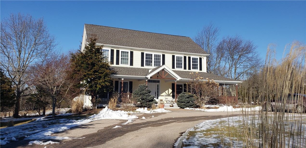 Spacious 4 bedroom colonial with adjacent 986 sq ft cottage.  Hydro air furnace, hardwoods, central air.  Walk out basement.  Detached 2 car garage with workshop and office above.  2.34 acres.  Convenient to the Village of Wakefield, beaches and area amenities.