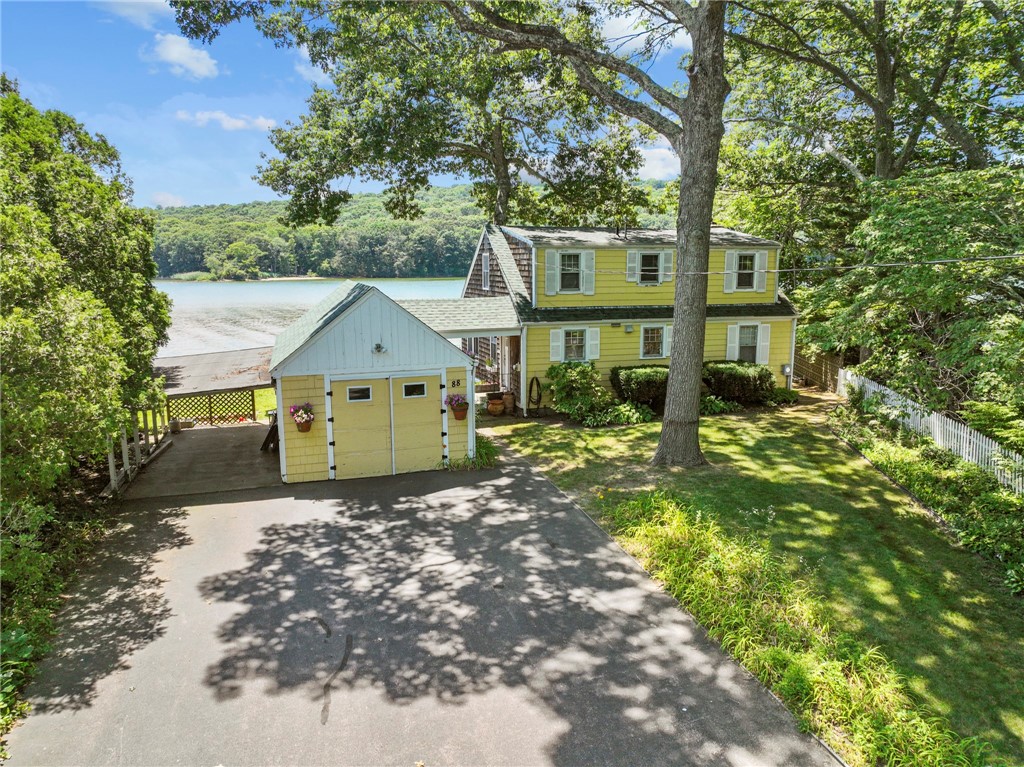 Rare opportunity to own expansive frontage on Narragansett's Pettaquamscut Lake.  This 13,500 sqft "mini-peninsula" is home to a classic Cape Cod style home situated on the lot for maximum water views. The living and dining rooms on the main floor offer panoramic views of the river.  Not opulently finished, but oozing with period charm, this property is of equal opportunity for owner occupants or second-home buyers in search of a generational prize.  Spring through Fall, this property is all about the outdoors--expansive yard for entertaining, private neighborhood beach next door and dock for your favorite water sports.  This is where memories are made.  When we say rare, we mean rare--this property has been sold just once in the last 73 years.  Minutes to picturesque beaches, countless coastal amenities and seaside villages--this address is the jumping off point for the best next phase of your life.