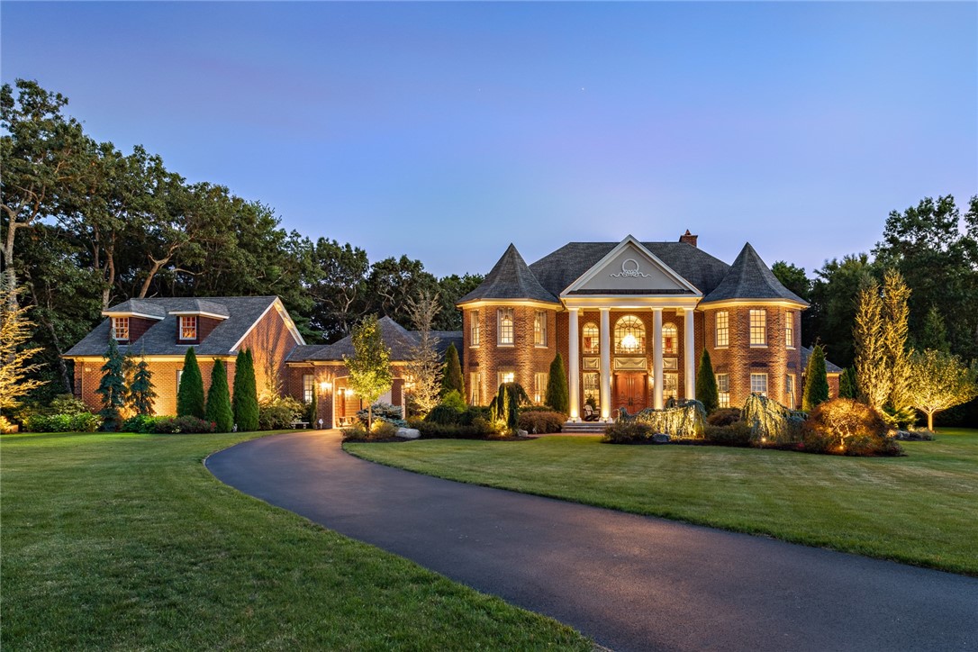 Enjoy elegant, easy living in this custom brick manor-style home. Top quality finishes and fine craftmanship are evident throughout, with highlights such as sweeping, custom double staircase, Brazilian cherry floors with walnut inlays, 20' ceilings, mosaic tile details, Schonbek lighting and Veissman mechanicals. The 1st floor primary suite features a sitting area, gas fireplace and soaking tub, separate vanities and double shower and exterior patio access. The kitchen is an entertainers dream, with wolf cooktop, double ovens, warming drawer, Subzero refrigerator, custom cabinetry, stone sink, butlers pantry and a incredible center island that features double think granite and room for even your largest family gatherings. A dining room with fireplace, home office with French doors & oversized windows, and a half bath, mudroom and laundry complete the first floor. The second floor features 3 ensuite bedrooms & baths featuring granite & tile as well as hardwood floors and walk-in closets. There is also a lofted den, or 2nd home office on the second level. There is an additional 3650sq. feet of unfinished basement space fully outfitted with radiant heated floors that provides plenty of room for expansion. There is garage parking for 4 cars and a stunning paver courtyard that provides ample additional parking. Both the front & back of the home offers bluestone patios. The home sits on 2 acres of beautifully landscaped grounds with mature plantings and landscape lighting.