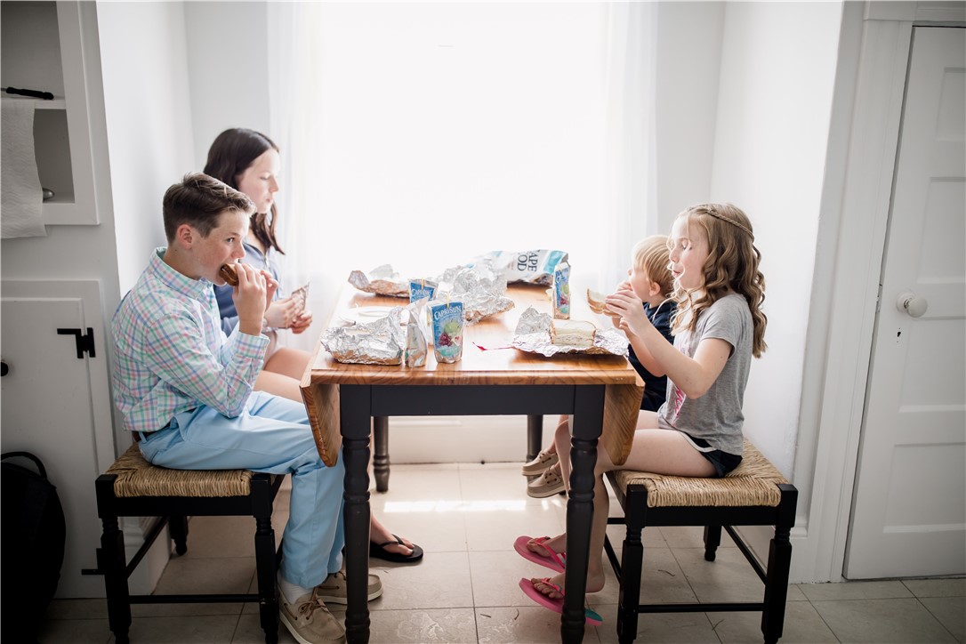 A family enjoying lunch in the kitchen
