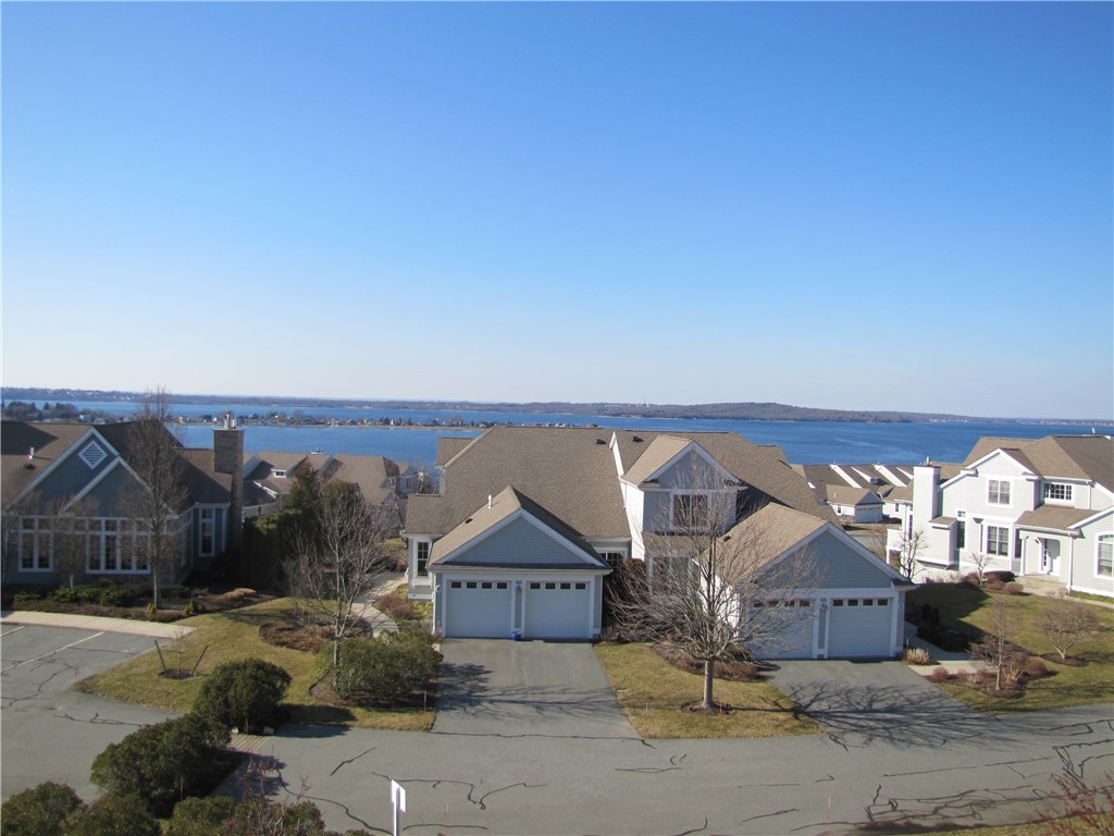 Rare rental opportunity at the Villages Mt. Hope Bay!  This waterfront condo with open floor plan and amazing views of the Mt. Hope Bridge is currently available for lease. Featuring a chef's kitchen, blue pearl granite, open floor plan, hardwood floors throughout, spacious dining room, fireplace living room that opens to an oversized deck. This unit features a 1st Floor Master Bedroom with Mater Bath and sliders to deck, 1st floor laundry and 1 car garage.  The lower level features spacious bedroom with sliders to patio, office area, and great room.  Lower level also features a full bath with oversized walk in shower, tub and double vanity.  Economical gas heat and central air.  Access to community pool, clubhouse, gym, tennis, walking trails and more.  This is an over 55 Community.  Call for more details and spend the summer on the water and enjoy all the beauty and activities the area has to offer!