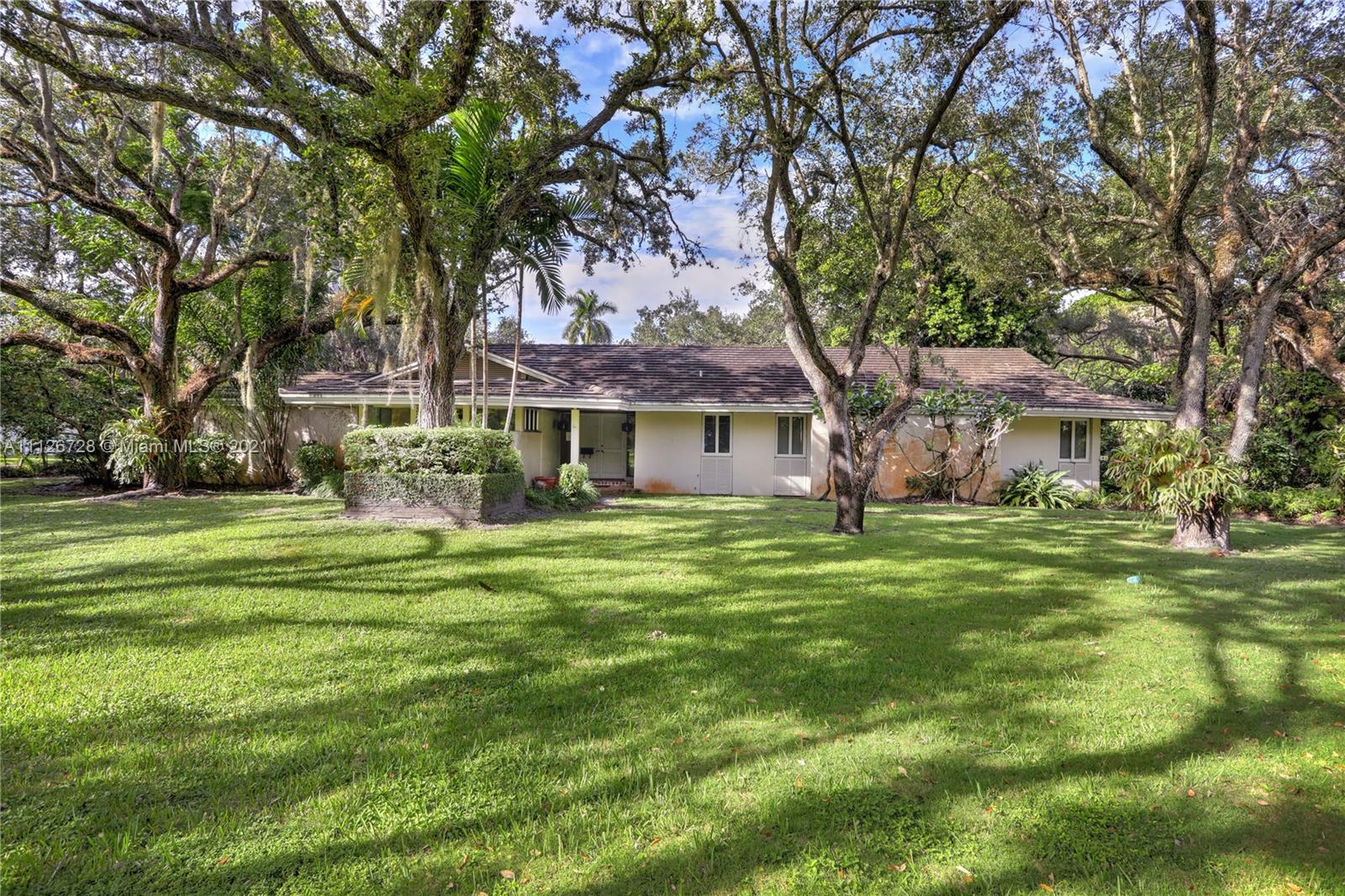 Situated among beautiful, gigantic oak trees, this stunning 51,000+ sf lot presents a golden opportunity for someone to either restore, renovate or rebuild the existing 4 bedroom, 4 bath home and pool house, complete with a full bathroom, or raze the existing house and build new.  Ideally convenient to a collection of Dade County’s best schools and amenities, there could be no better opportunity! Snapper Creek Lakes not only boasts some of our county’s most beautifully presented large residences, it also offers a private marina for its residents’ use. Association membership is a prerequisite to purchase.